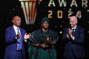 Ademola Lookman with FIFA President Gianni Infantino and CAF President Patrice Motsepe after winning the CAF POTY. Photo credit: X