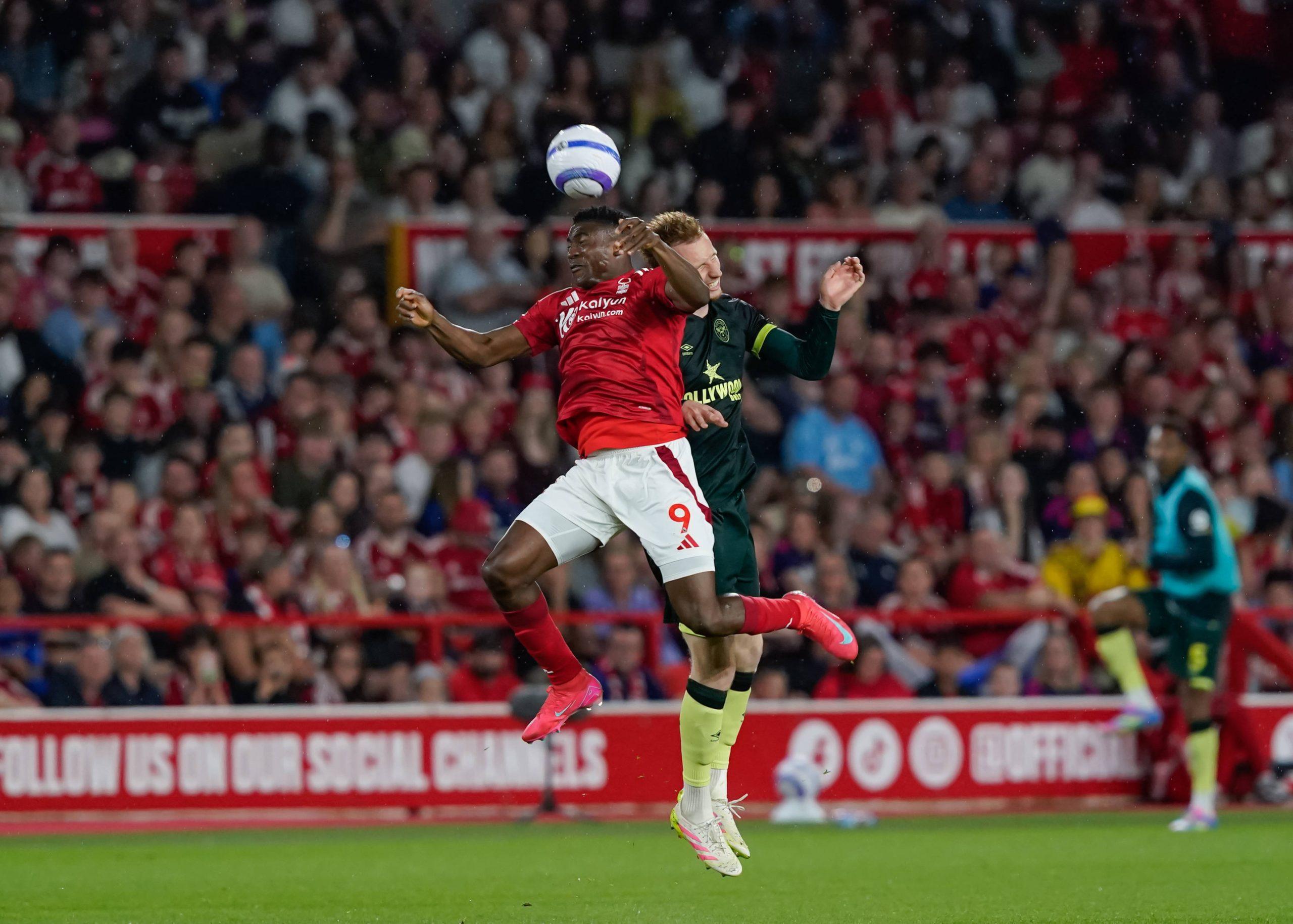 Taiwo Awoniyi of Nottingham Forest and Sepp van den Berg of Brentford battle for the ball during the Nottingham Forest vs Brentford
