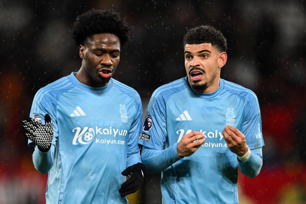 Ola Aina and Morgan Gibbs-White in conversation during the Premier League match Manchester United vs Nottingham Forest at Old Trafford.