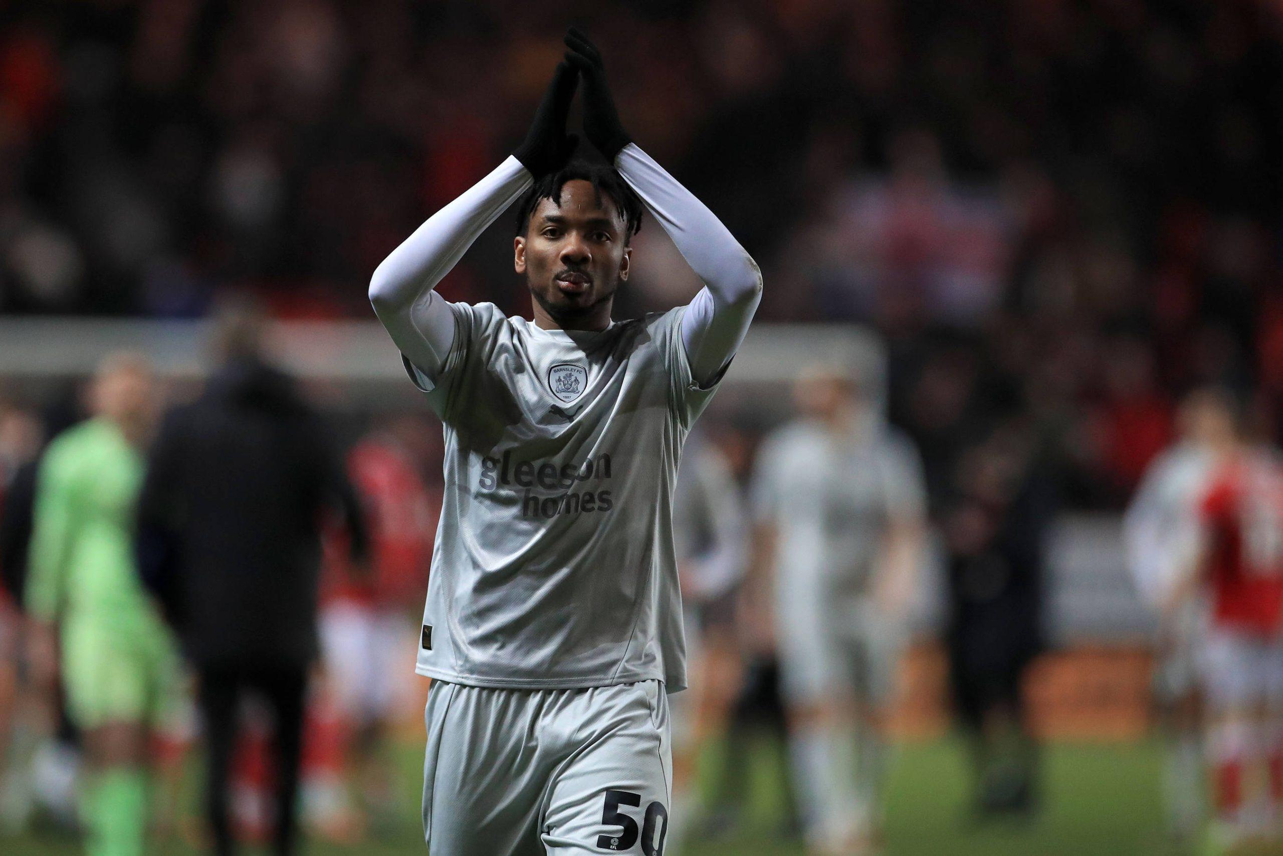 Kelechi Nwakali Midfielder 50 of Barnsley applauds fans at full time 