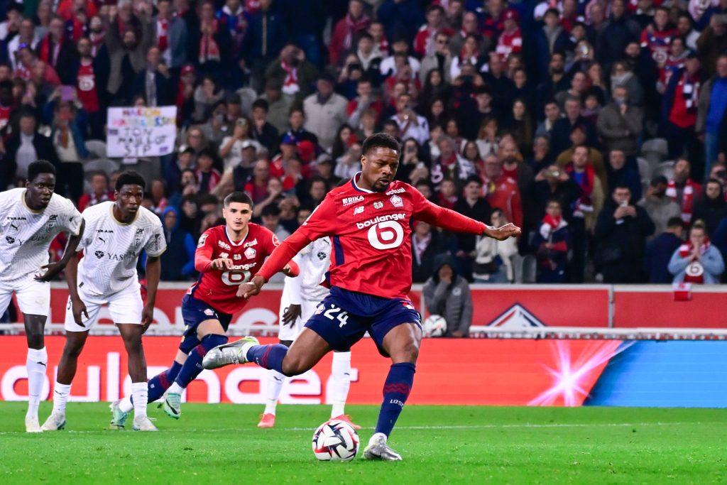 Chuba Akpom scores his penalty during the Ligue 1 match between Lille OSC and Stade de Reims