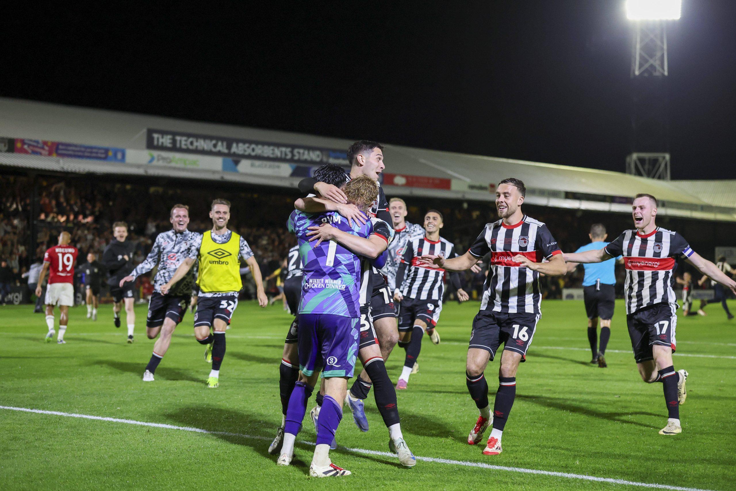 Grimsby players celebrate winning penalty shootout Grimsby Town goalkeeper Christy Pym 1 Grimsby Town defender Reece Staunton
