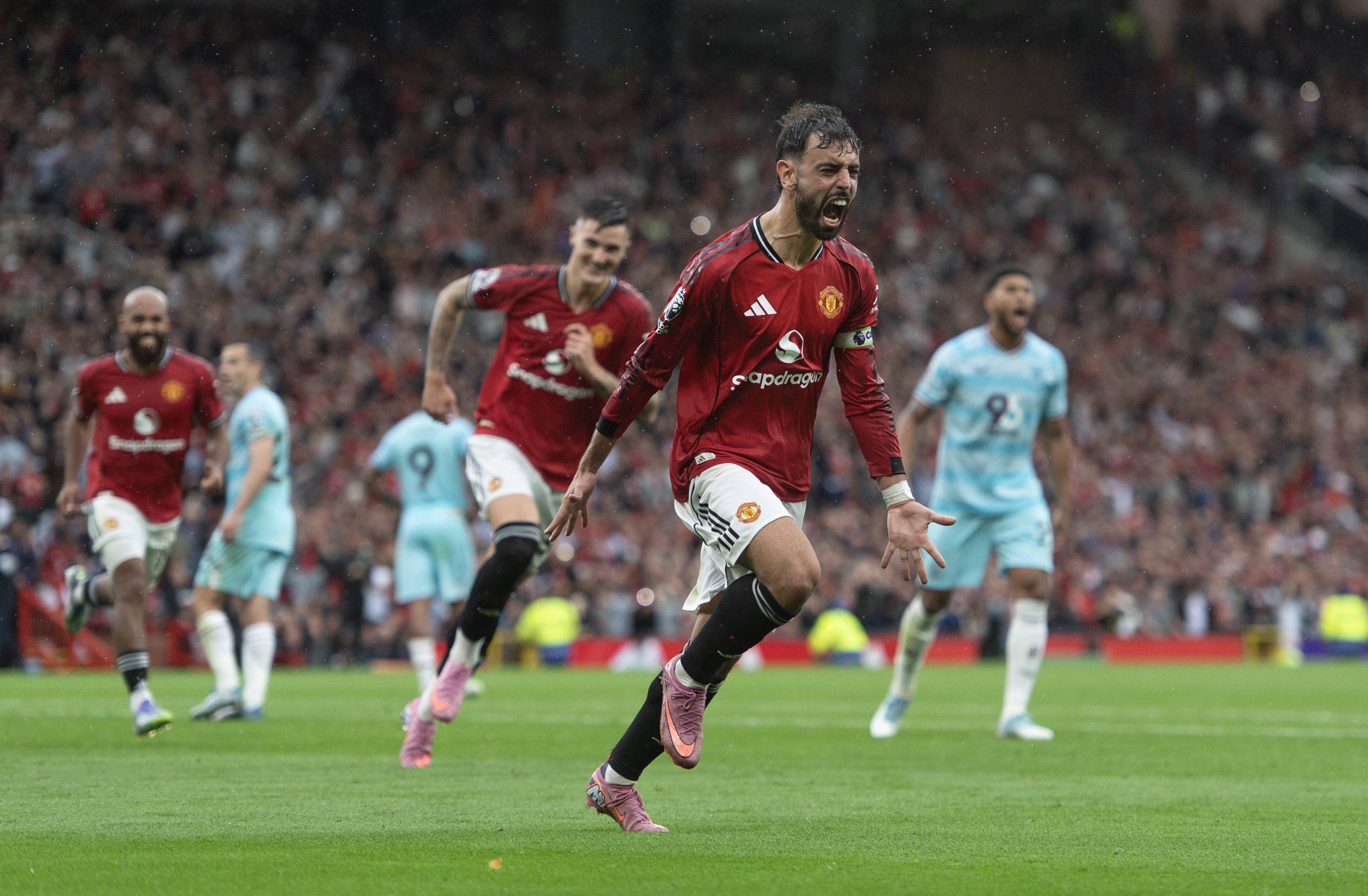 Bruno Fernandes celebrates scoring the third and winning goal from a penalty during the Premier League match between Manchester United and Burnley at Old Trafford