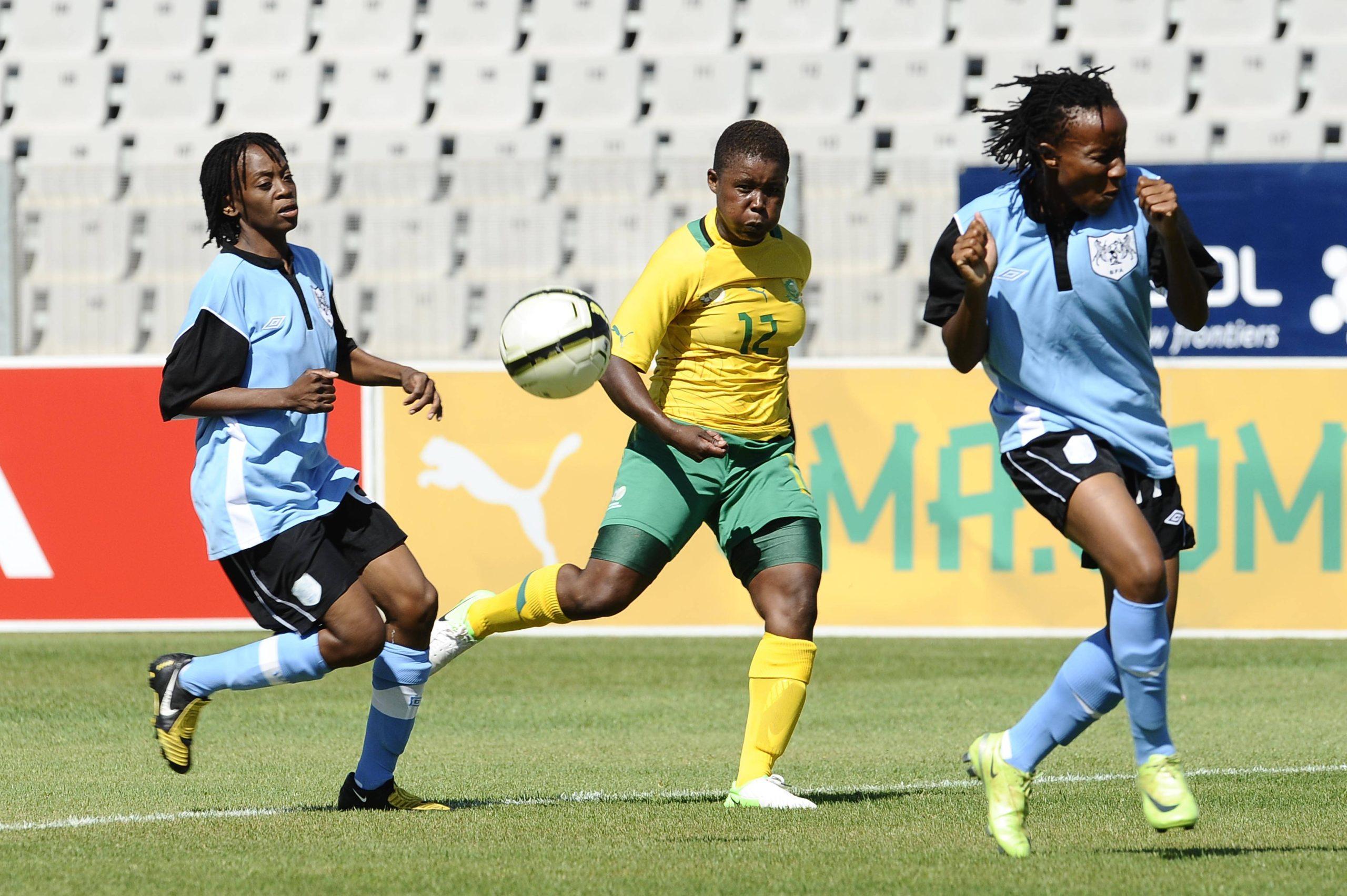 Portia Modise and Onneile Tom with Phatsimo Bosa during the Womens International Friendly match between South Africa and Botswana