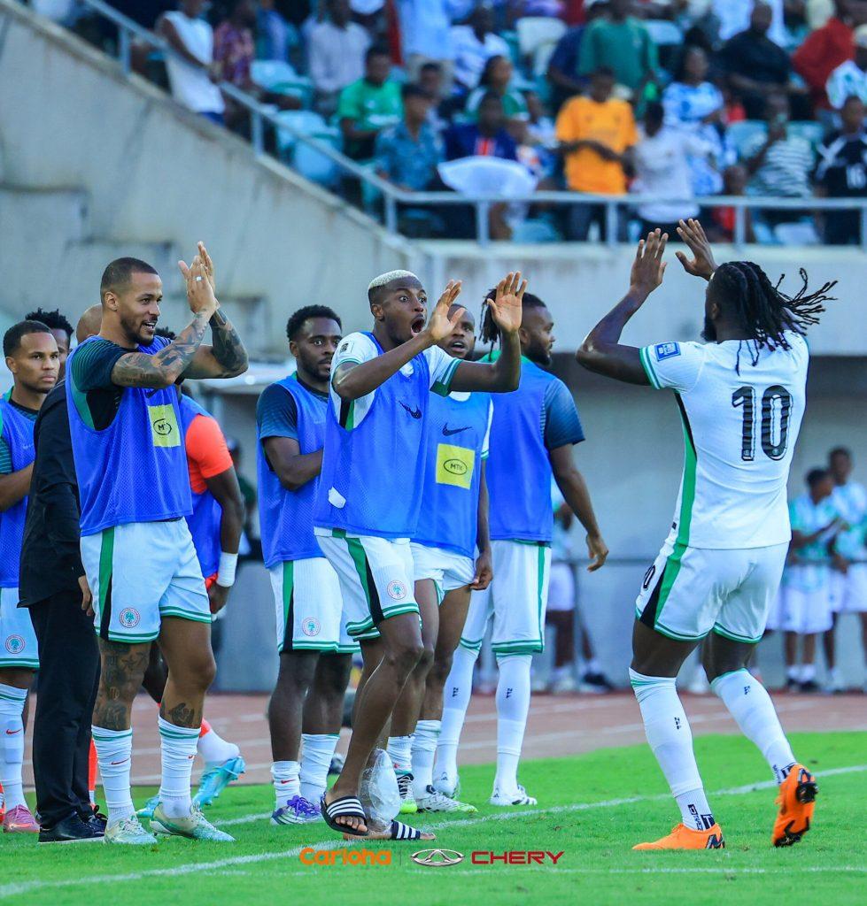 Tolu Arokodare rushed to the bench to celebrate with Victor Osimhen after his goal in Nigeria's clash against Rwanda