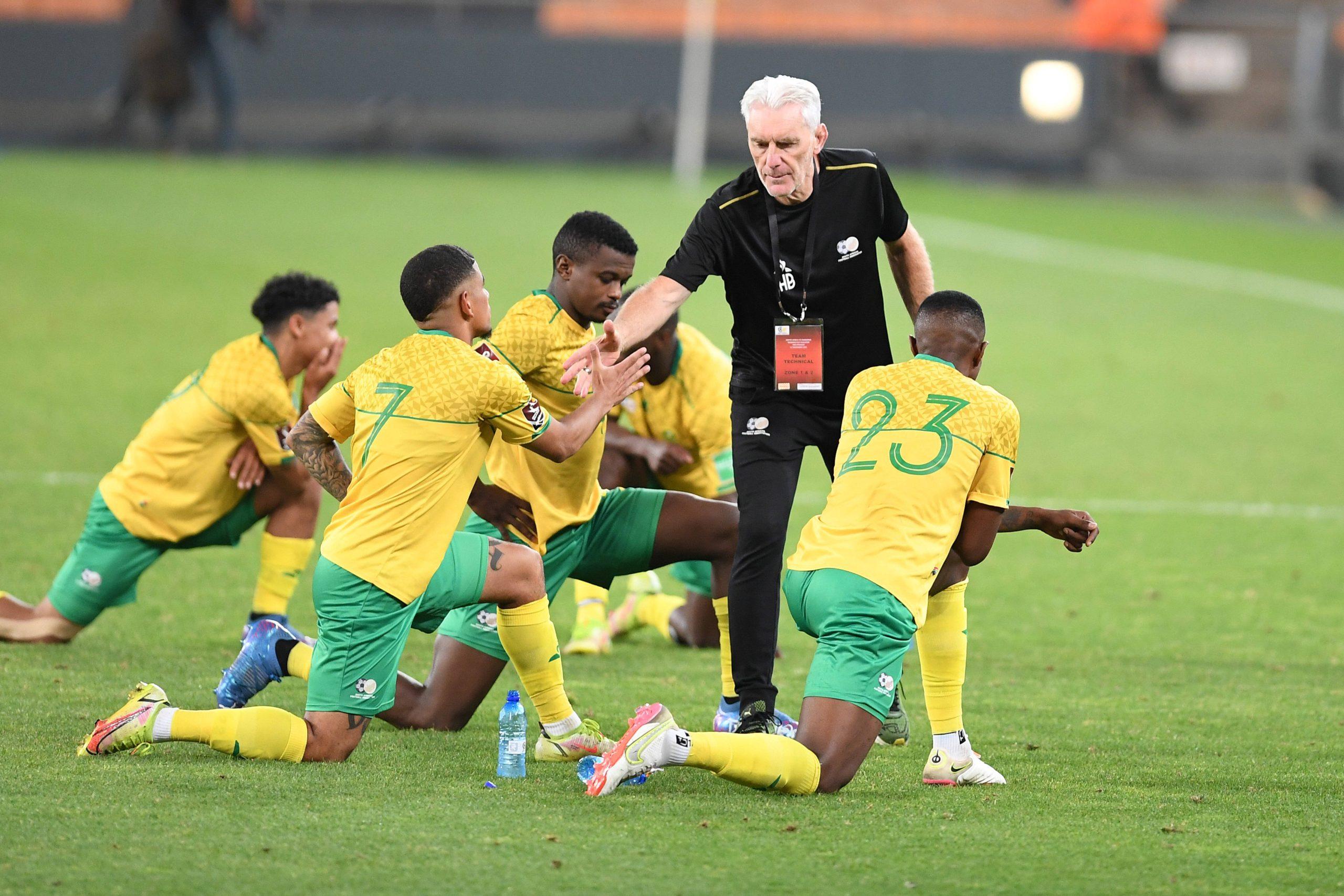 South Africa coach Hugo Broos greets players during the 2022 FIFA World Cup, qualifier match between South Africa and Zimbabwe at FNB Stadium