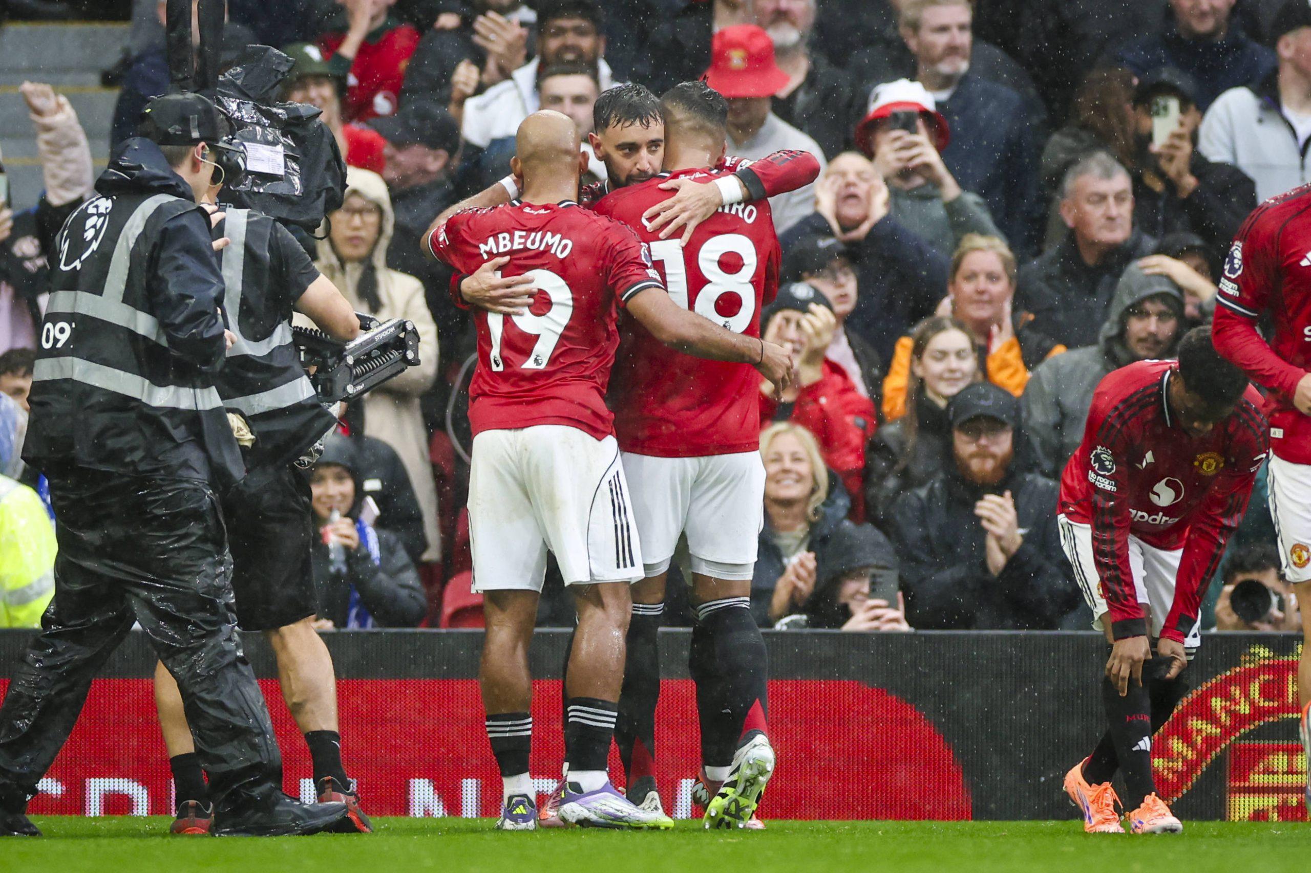 Manchester United midfielder Bruno Fernandes 8 scores a GOAL 1-0 and celebrates Manchester United forward Bryan Mbeumo 19 Manchester United midfielder Casemiro 18 during the Manchester United FC v Chelsea match