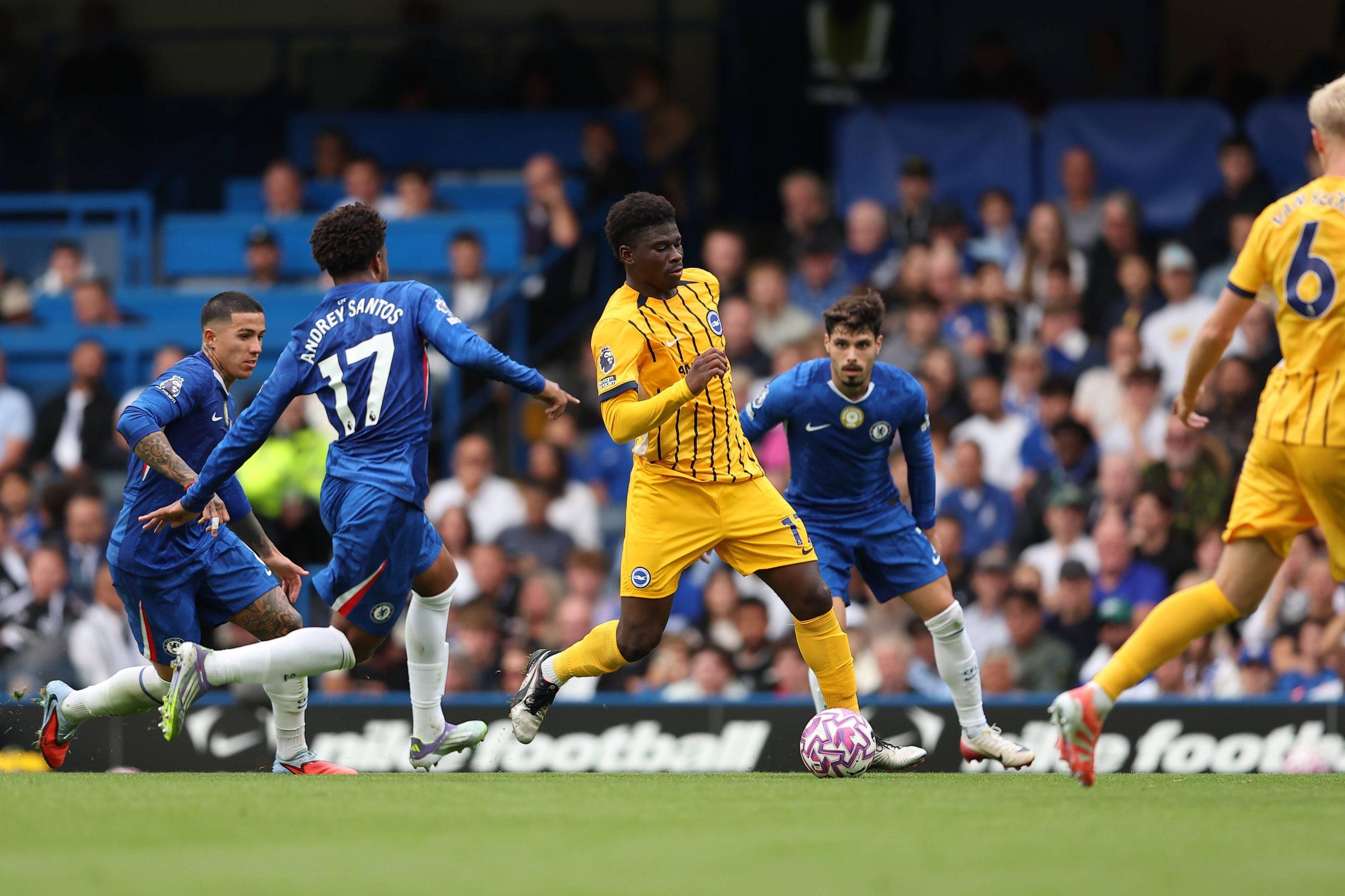 Carlos Baleba of Brighton & Hove Albion closely marked by Andrey Santos of Chelsea