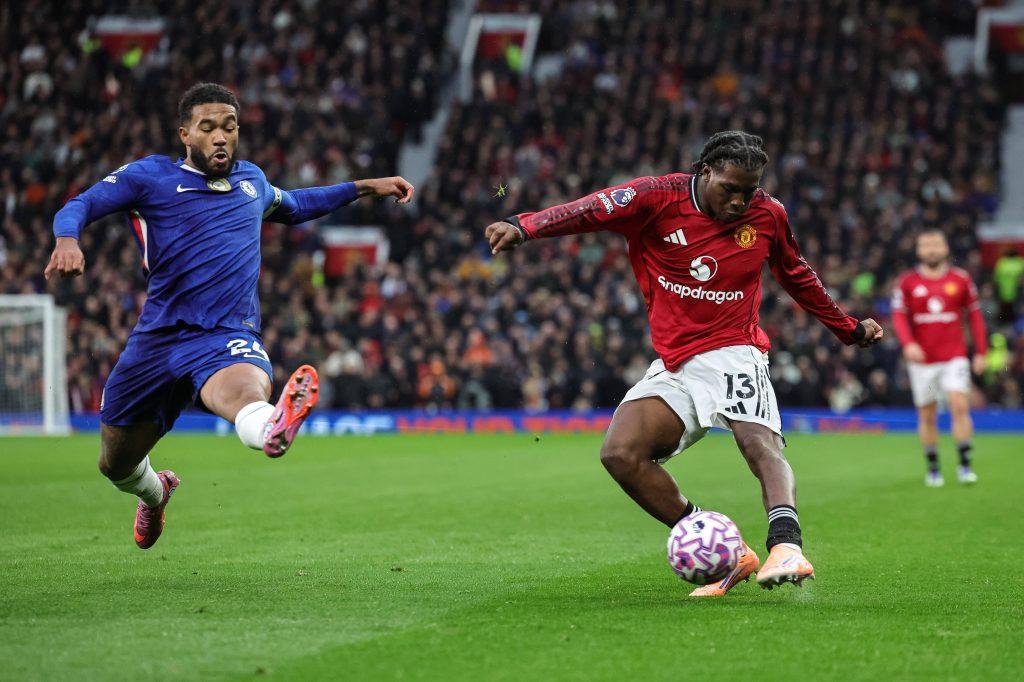 Reece James blocks a cross from Patrick Dorgu during the Premier League match Manchester United vs Chelsea at Old Trafford