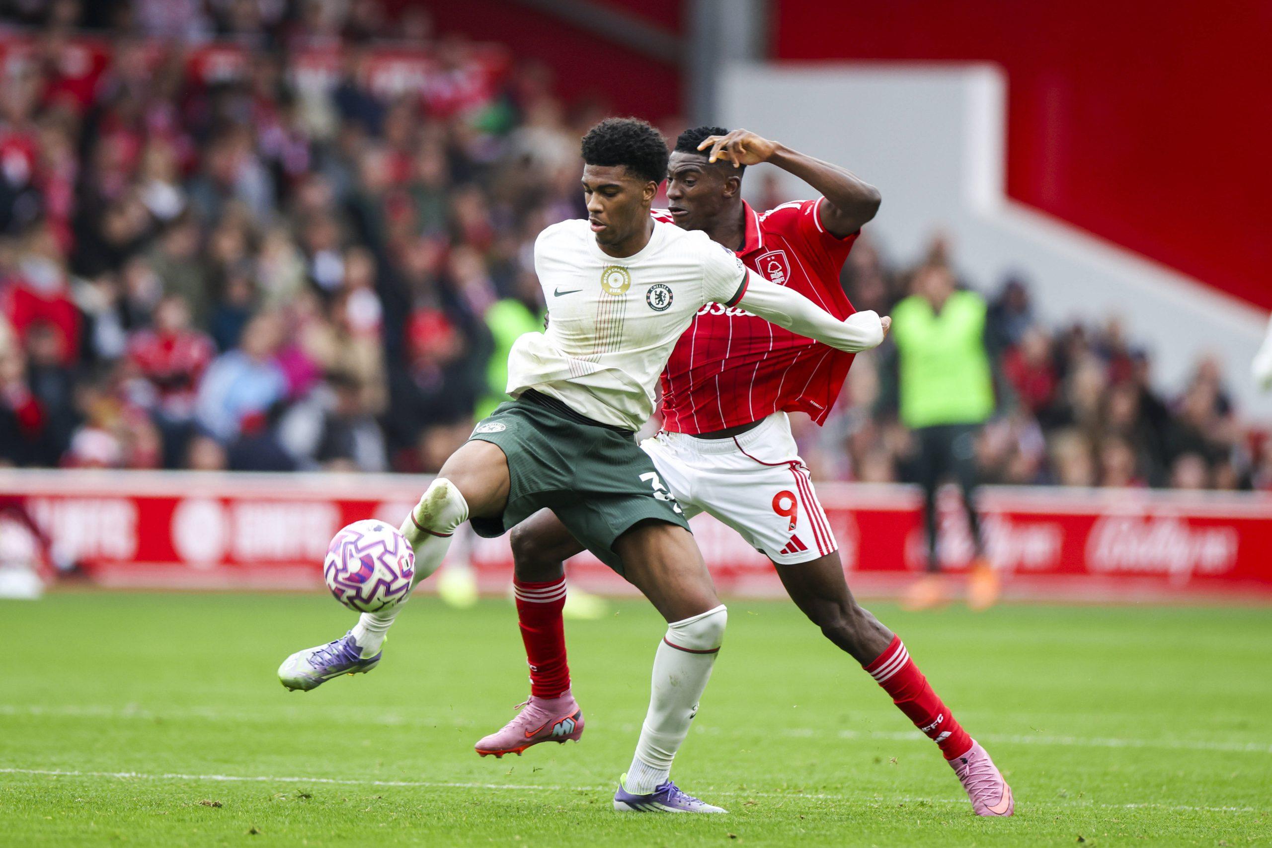 Josh Acheampong battles Taiwo Awoniyi during the Nottingham Forest v Chelsea