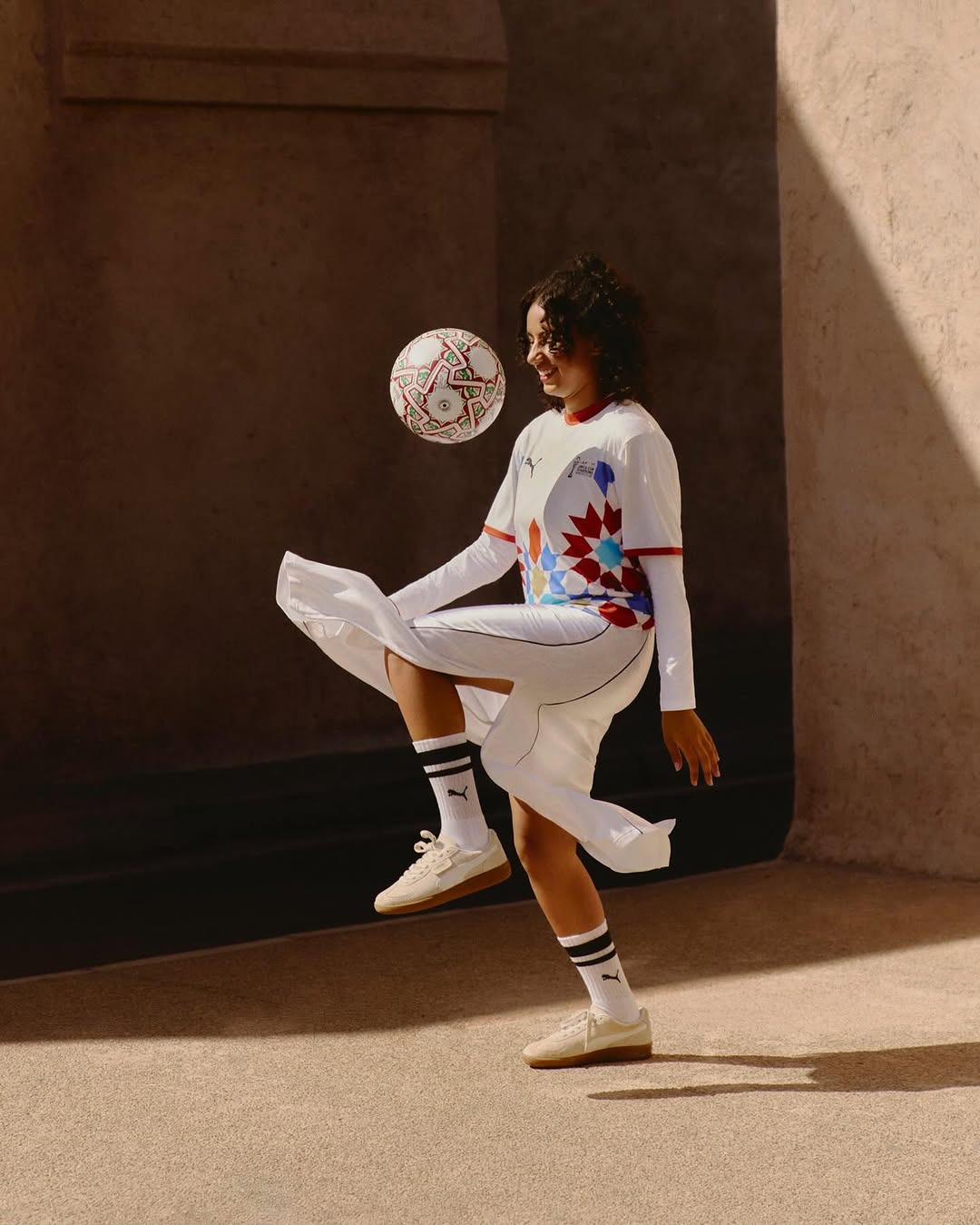A lady playing the AFCON 2025 official match ball 