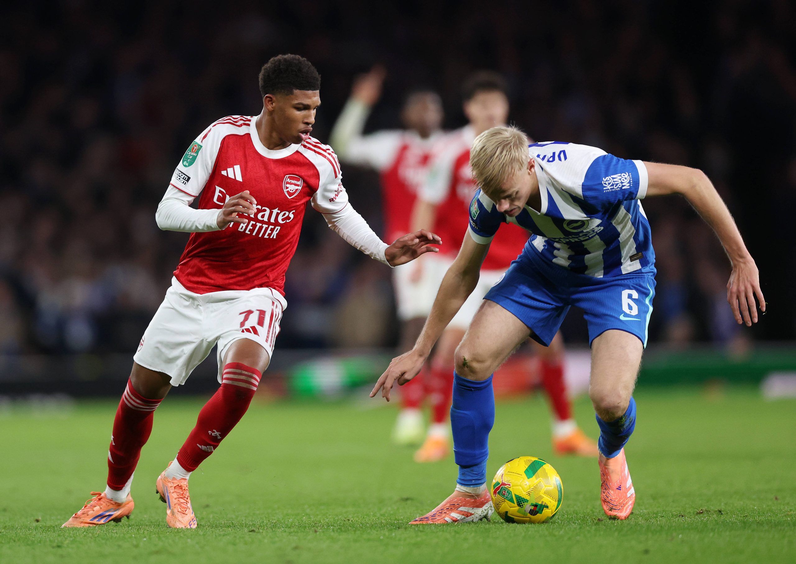 Andre Harriman-Annous of Arsenal with Jan Paul van Hecke of Brighton during the Arsenal vs Brighton and Hove Albion Carabao Cup match at the Emirates Stadium