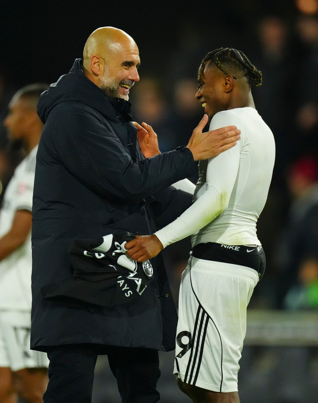 A light moment between Pep Guardiola and Samuel Chukwueze 