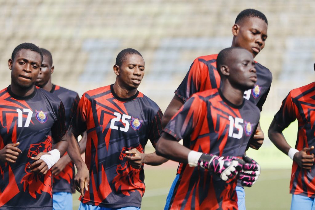 Dino SC players out on the turf before a game