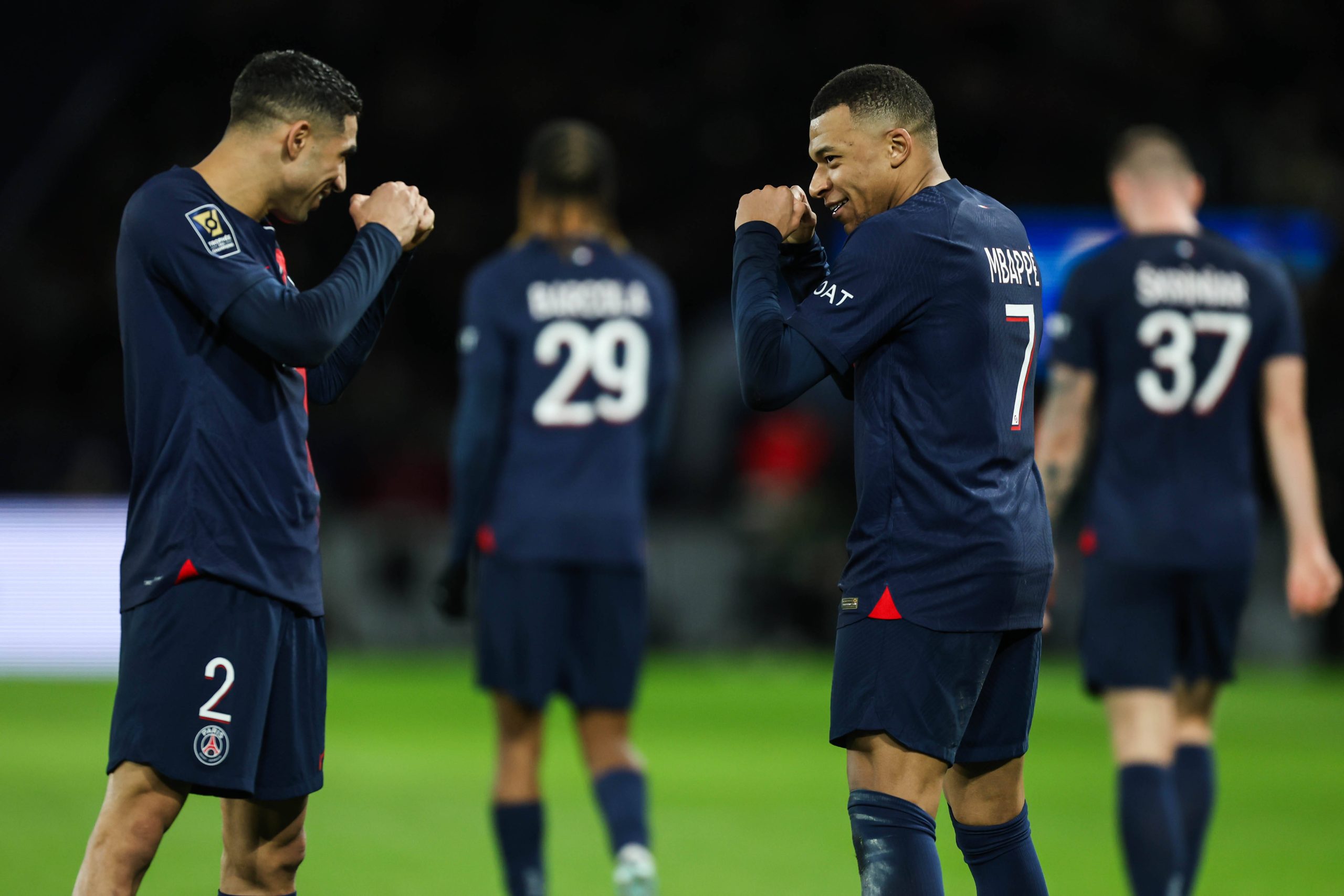 Kylian Mbappe celebrating his goal with Achraf Hakimi