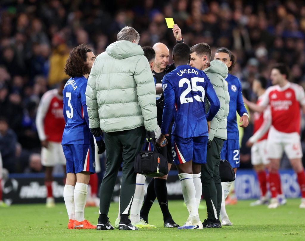 Moises Caicedo gets booked before its overturned for a red card during the Chelsea vs Arsenal 