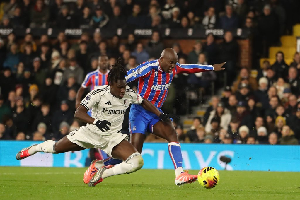 Calvin Bassey tussles with Jean Philippe Mateta during the Fulham vs Crystal Palace Premier League match