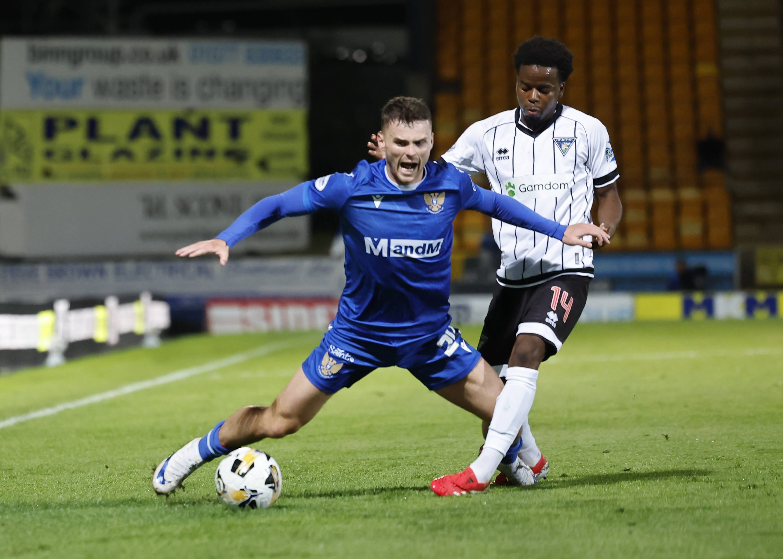 Josh McPake of St Johnstone left is tackled by Alfons Amade of Dunfermline Athletic during the William Hill Championship match at McDiarmid Park