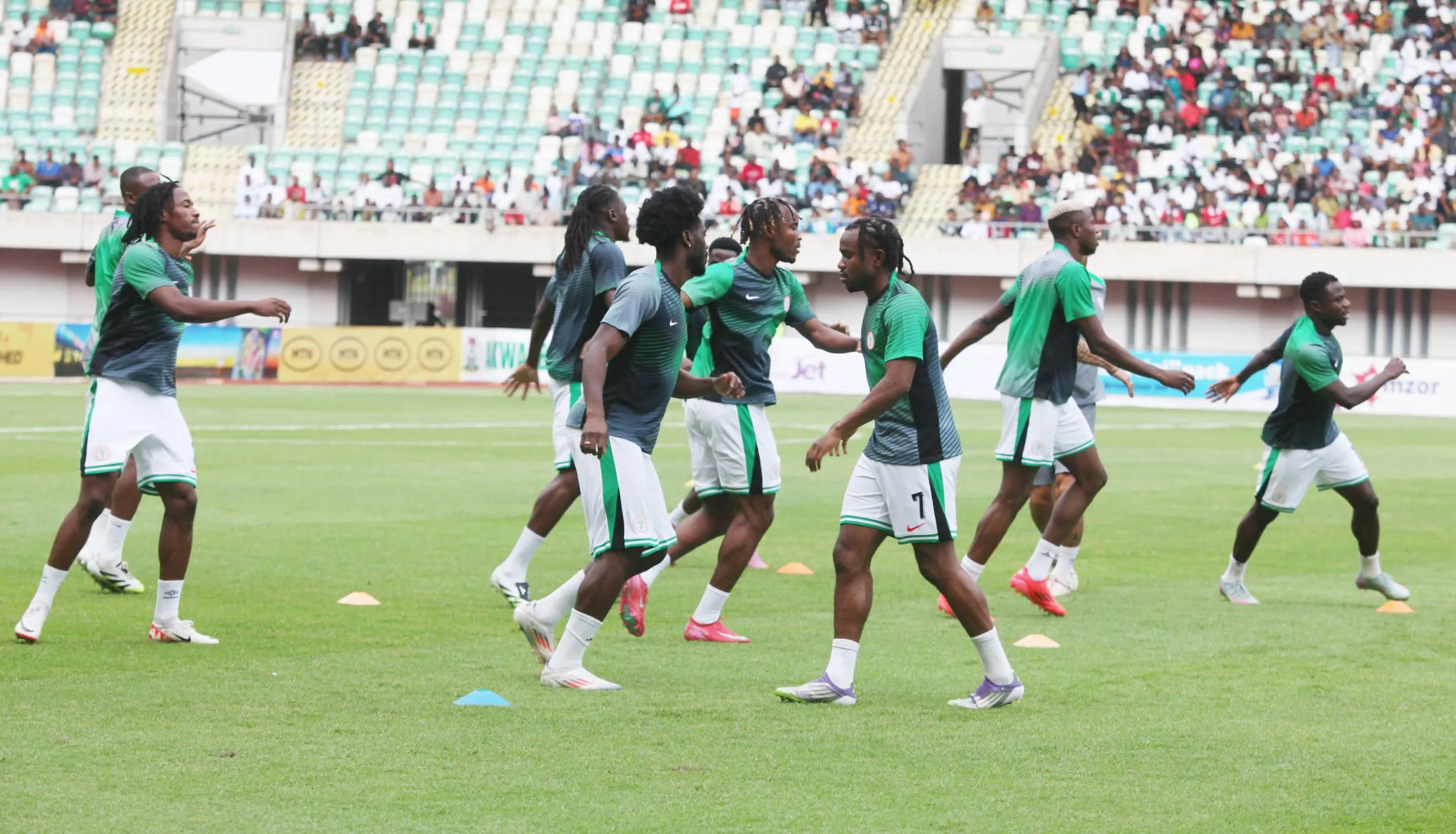 Super Eagles warm up during the 2026 FIFA World Cup Qualifier match between Nigeria s Super Eagles and Rwanda Amavubi, which Nigeria wins 1-0, at Godswill Akpabio Stadium Uyo