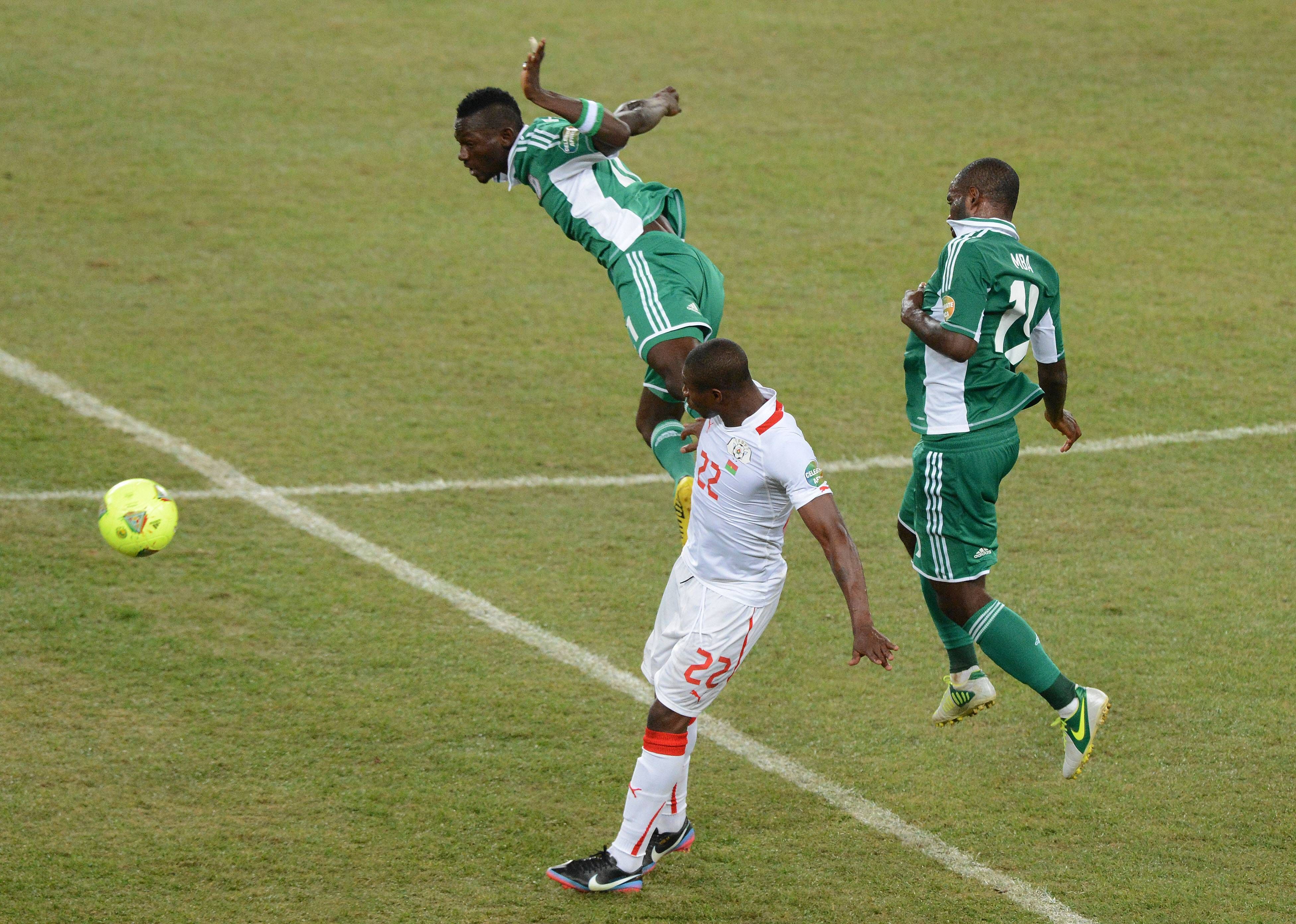 Juwon Oshaniwa wins the header during the 2013 AFCON Final match between Nigeria and Burkina Faso