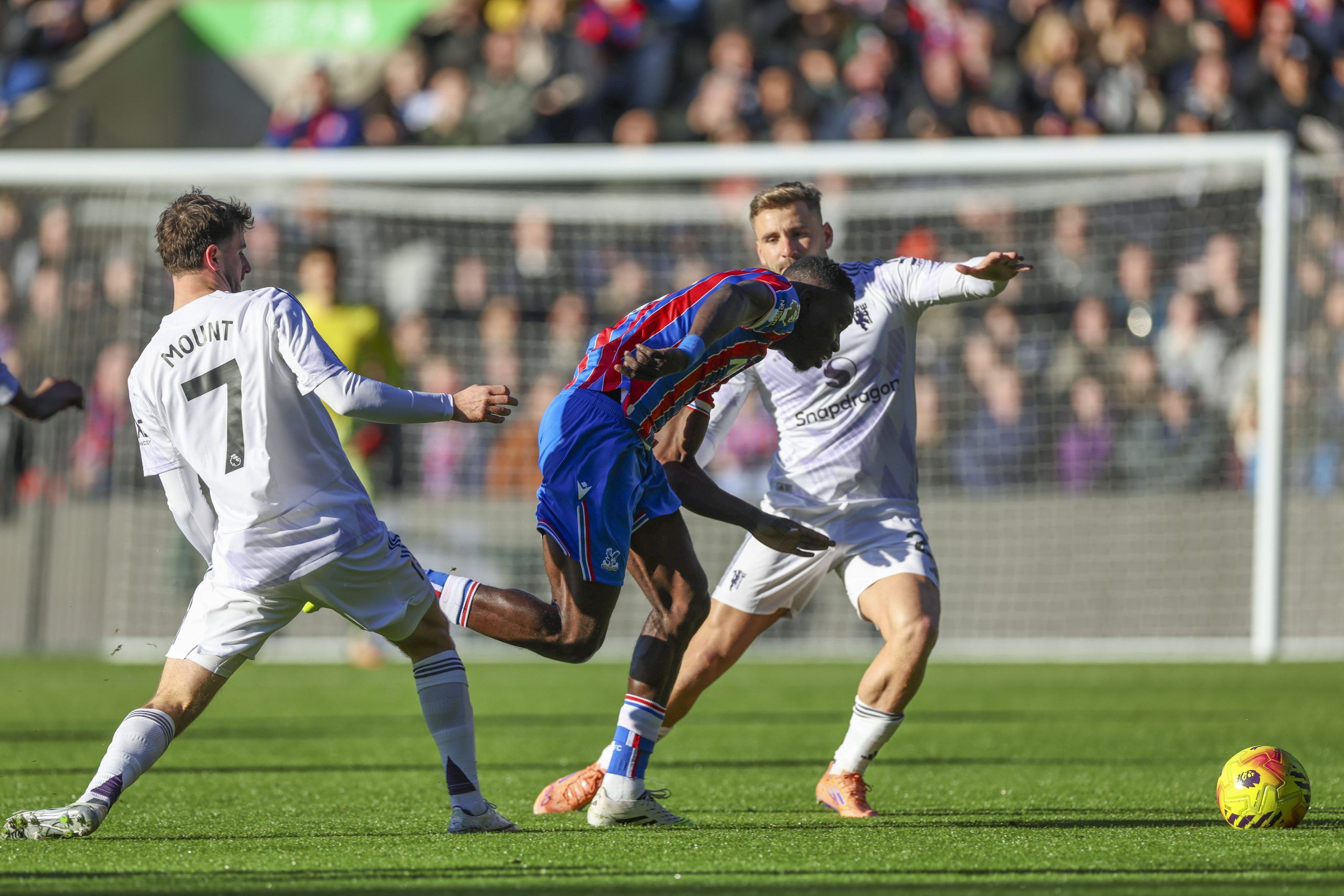 Jean-Philippe Mateta in action Manchester United defender Luke Shaw Manchester United midfielder Mason Mount during the Crystal Palace v Manchester United clash