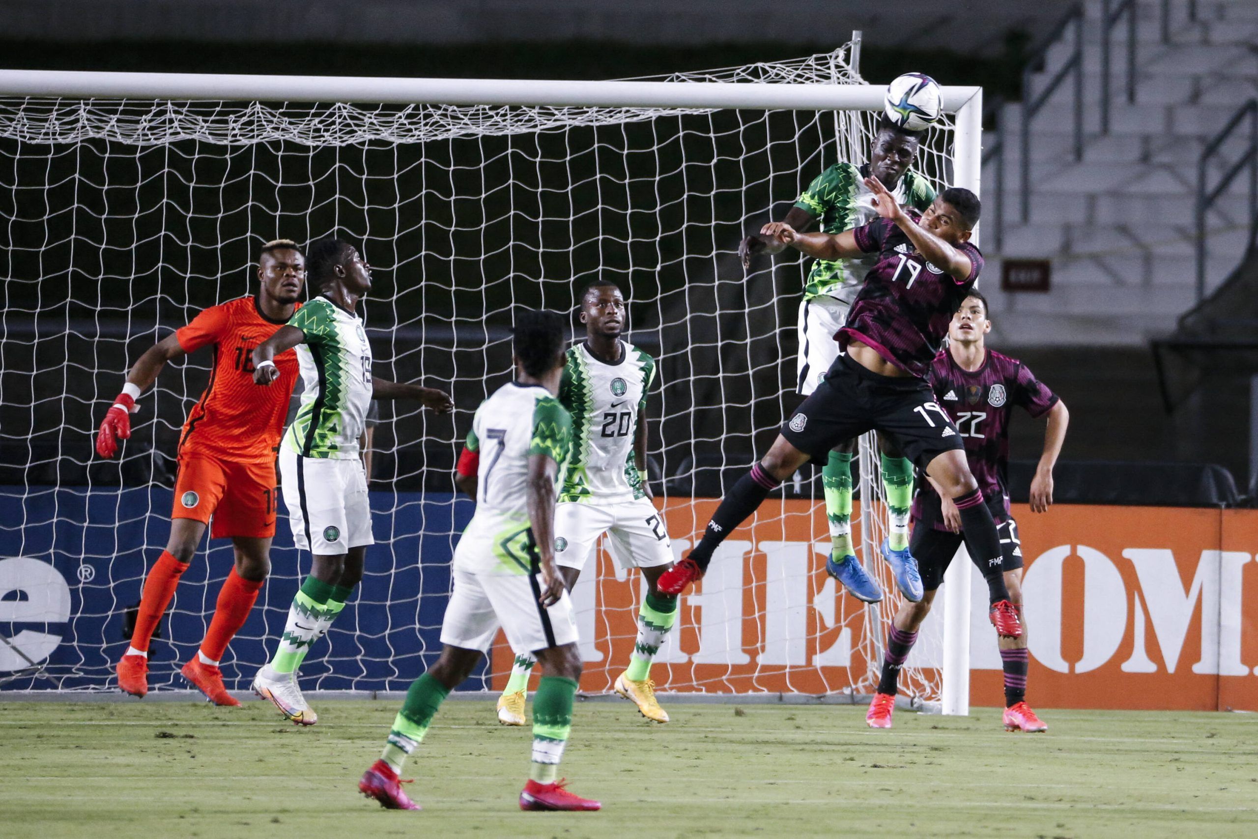 Mexico defender Gilberto Sepulveda 19 and Nigeria defender Adekunle Adeleke fight for a head ball during the first half of an International Friendly