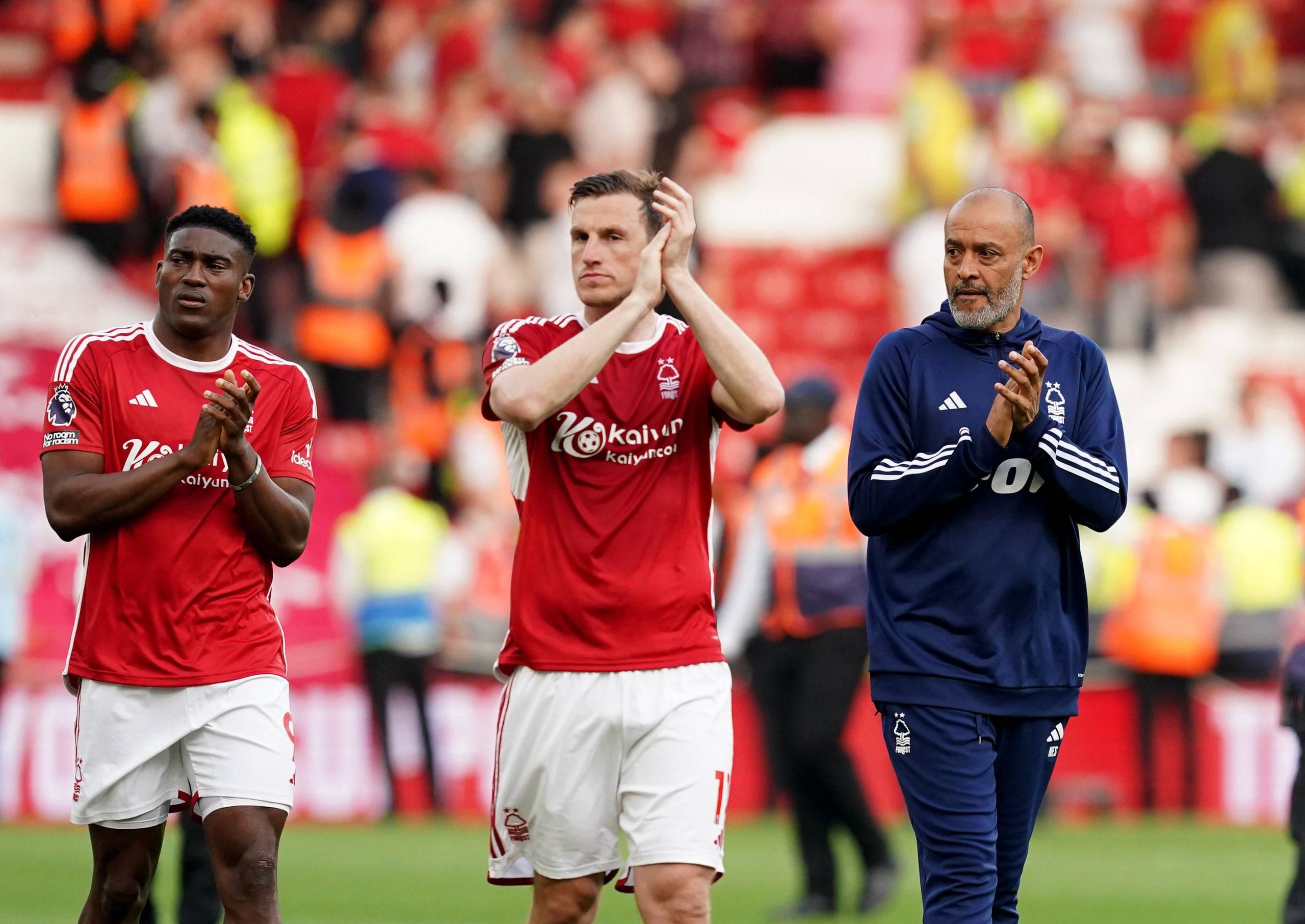 Nottingham Forest manager Nuno Espirito Santo right walks around the pitch with Taiwo Awoniyi left and Chris Wood