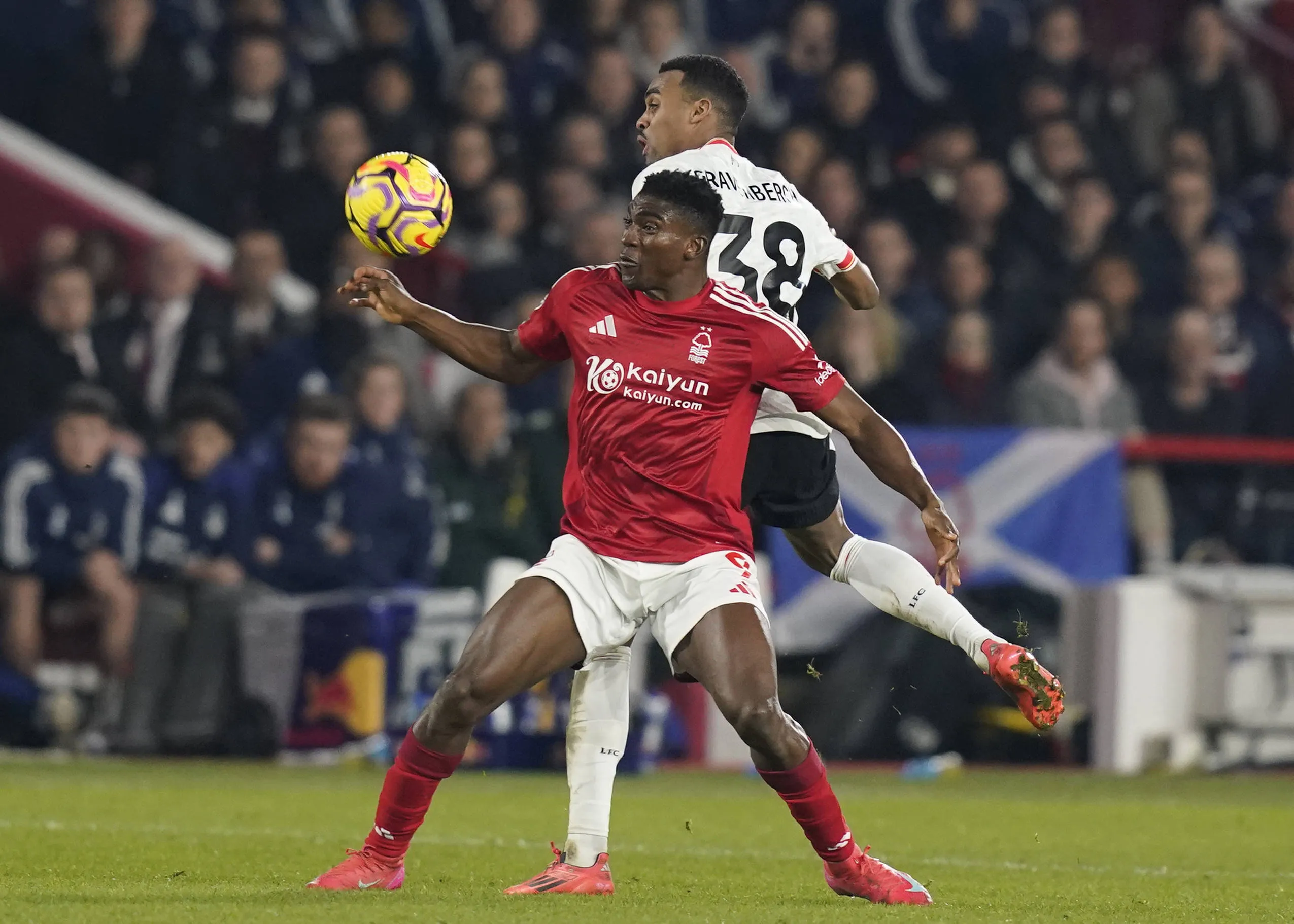 Ryan Gravenberch of Liverpool tussles with Taiwo Awoniyi of Nottingham Forest during the Premier League match at the City Ground, Nottingham