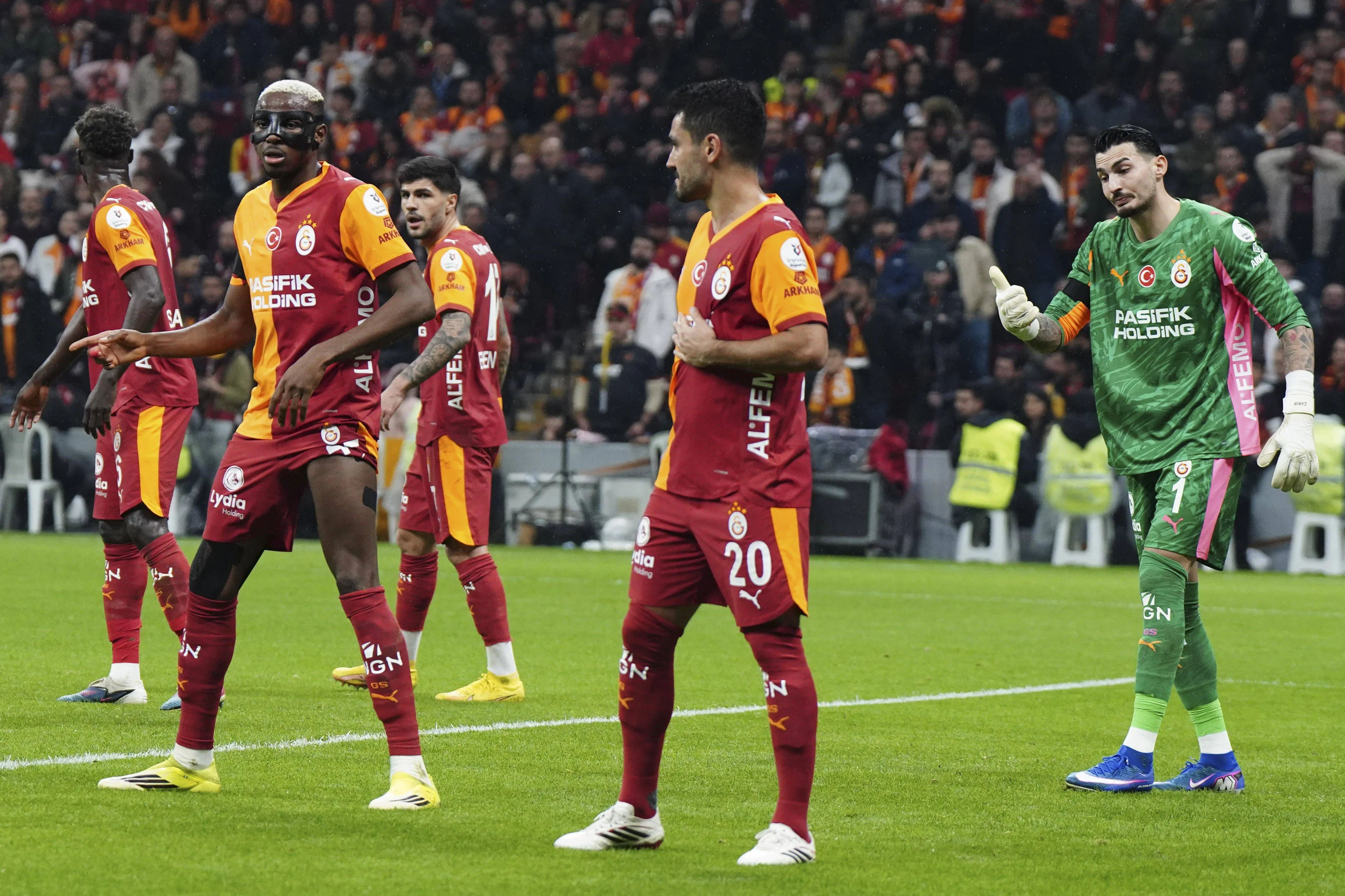 Victor Osimhen 45 and Ilkay Gundogan 20 of Galatasaray