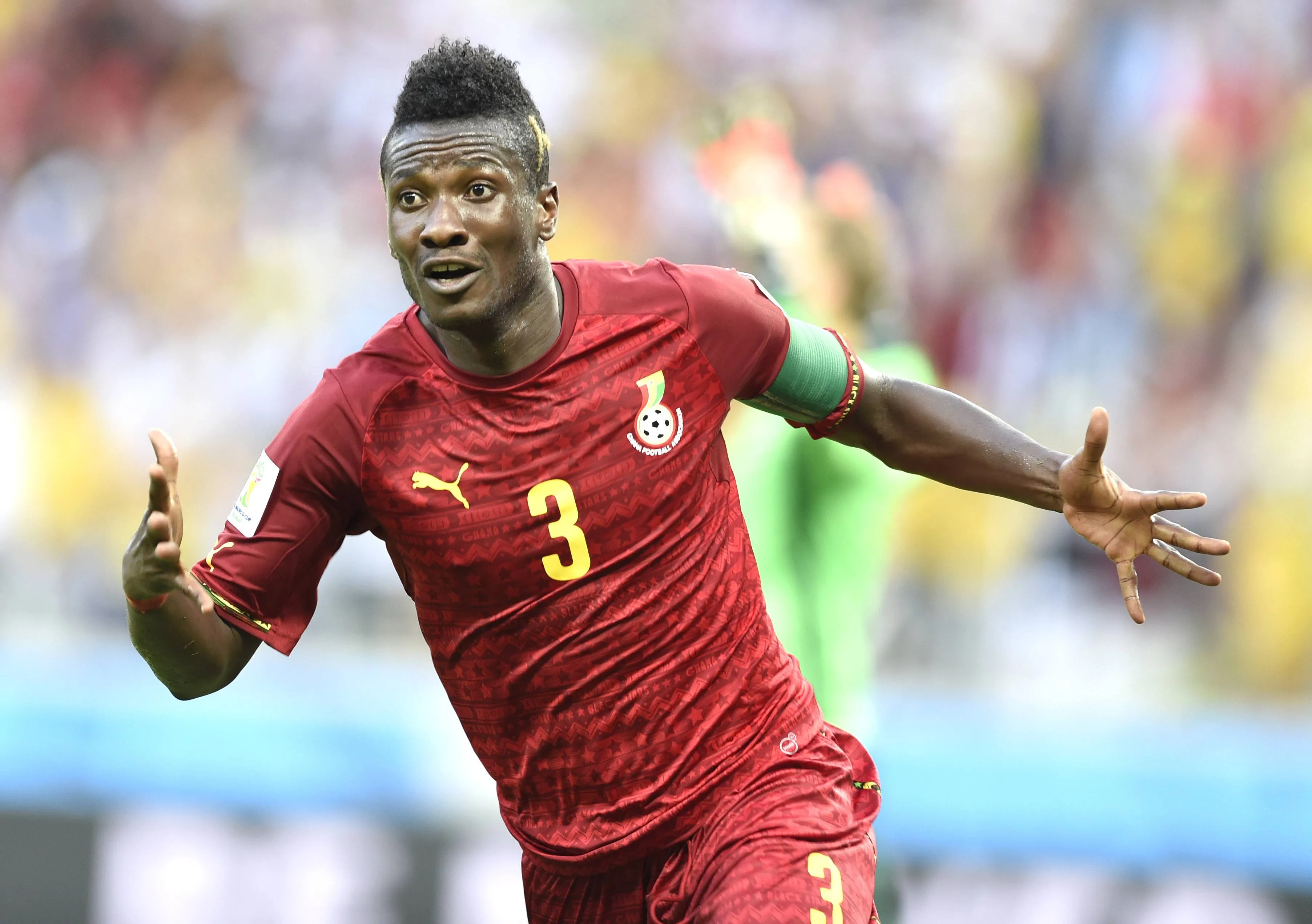 Asamoah Gyan of Ghana Celebrates Scoring