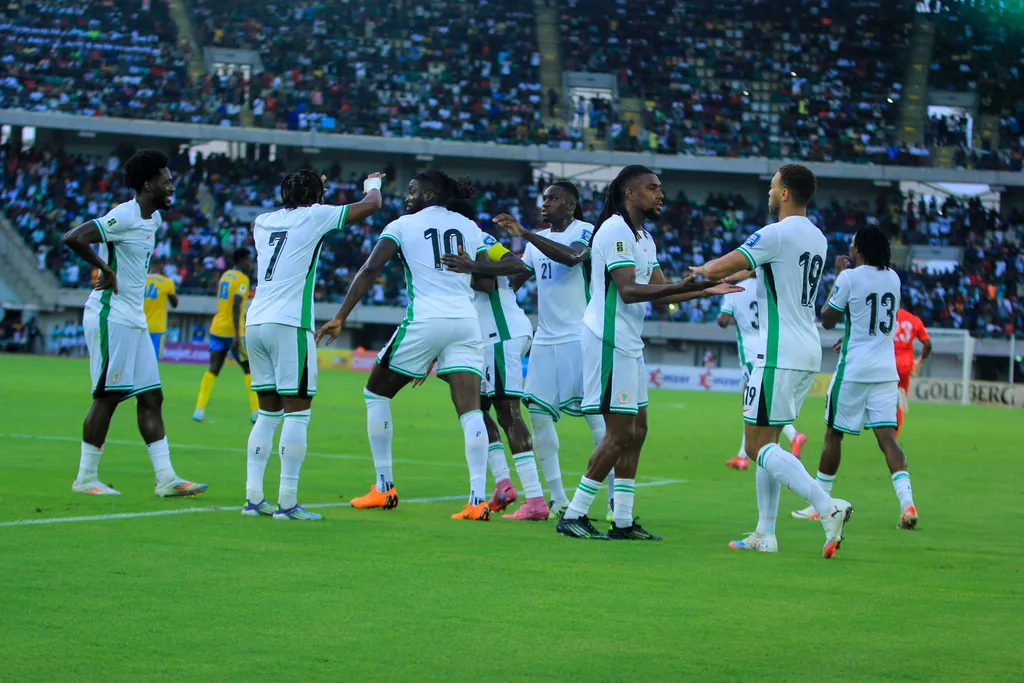 Nigeria celebrate during the 2026 FIFA World Cup qualifying match between the Super Eagles of Nigeria and the Amavubi of Rwanda at the Godswill Akpabio Stadium