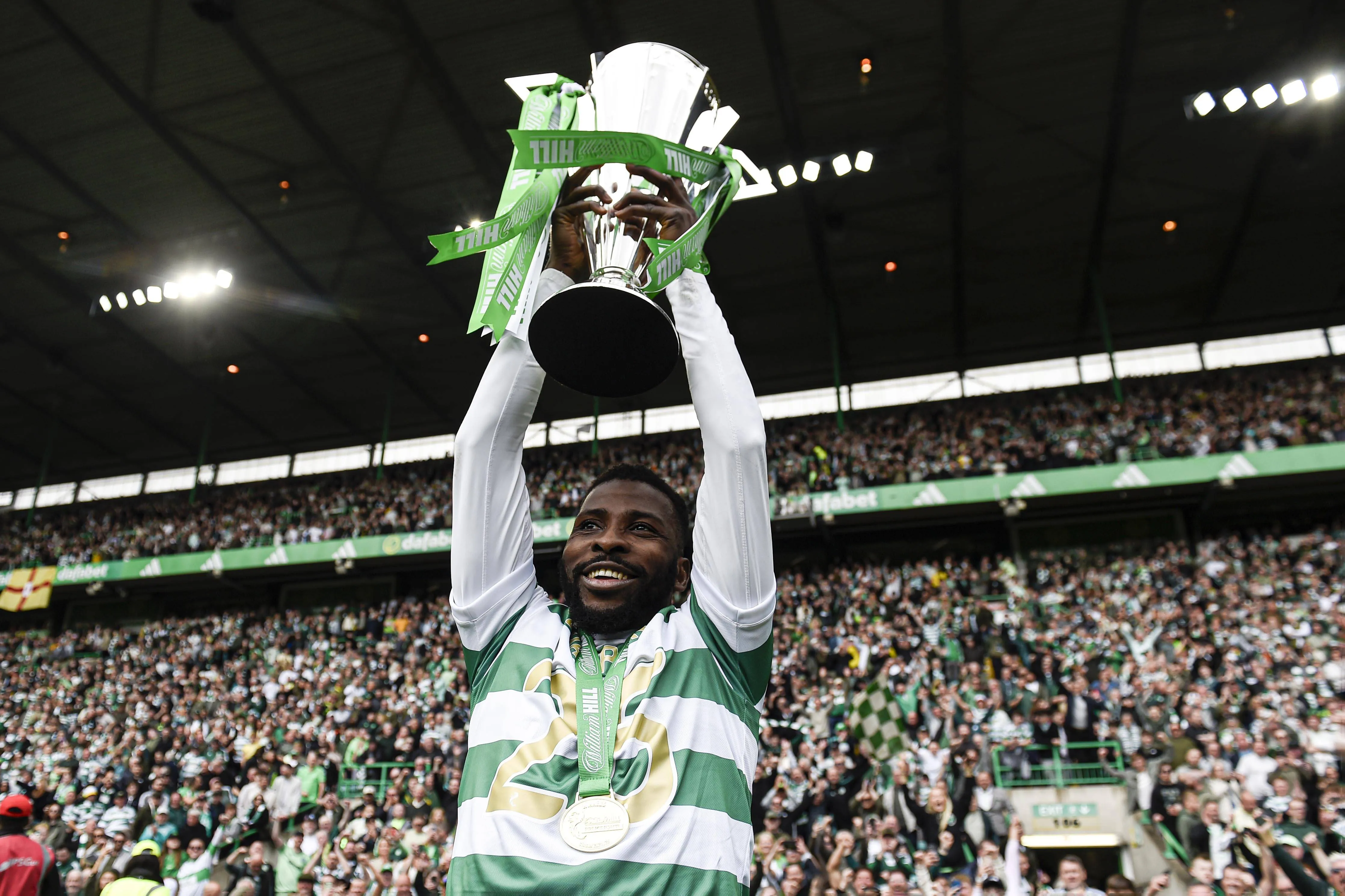 Kelechi Iheanacho of Celtic poses with the William Hill Premiership Trophy at full time during the William Hill Premiership match at Celtic Park, Glasgow.