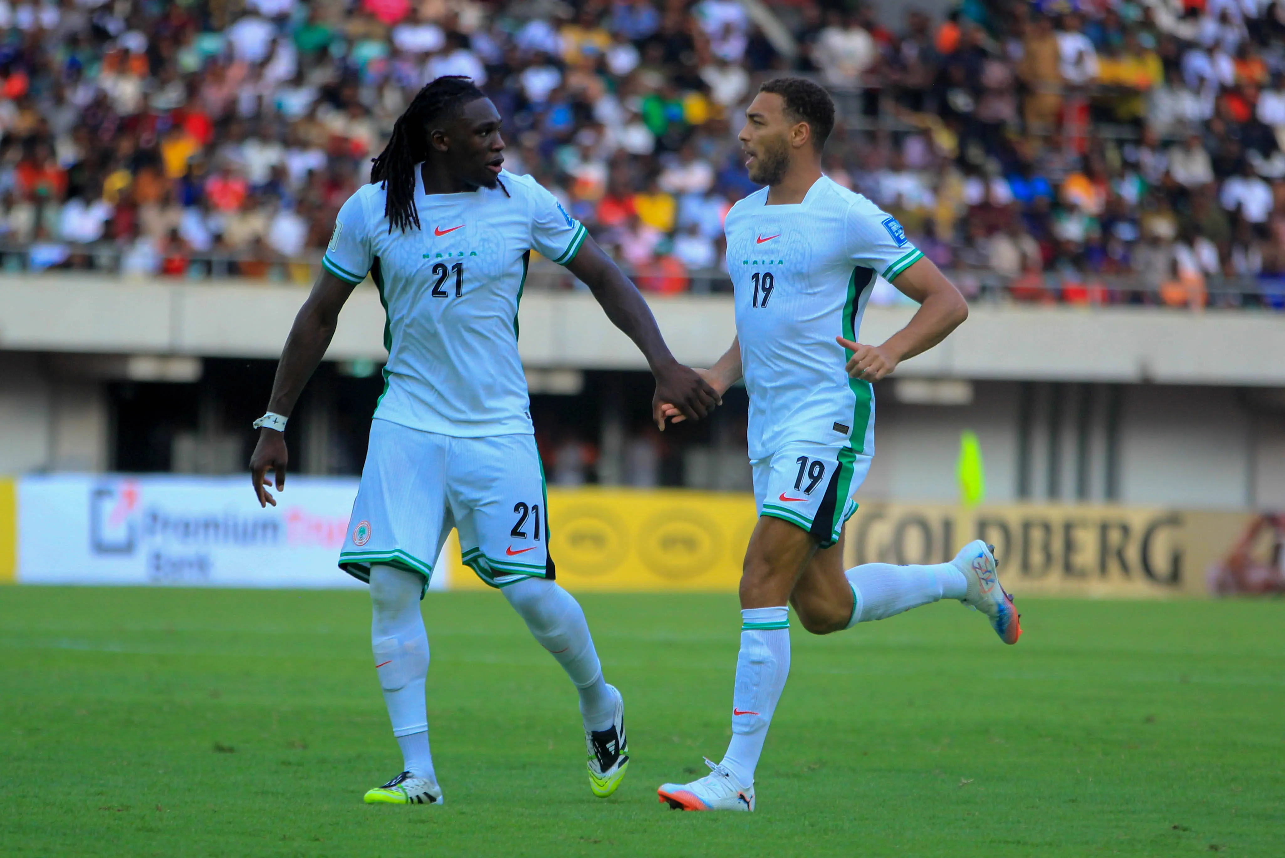 Calvin Bassey and Cyriel Dessers of Nigeria during the 2026 FIFA World Cup qualifying match between the Super Eagles of Nigeria and the Amavubi of Rwanda at the Godswill Akpabio Stadium on September 6, 2025 in Uyo, Nigeria.