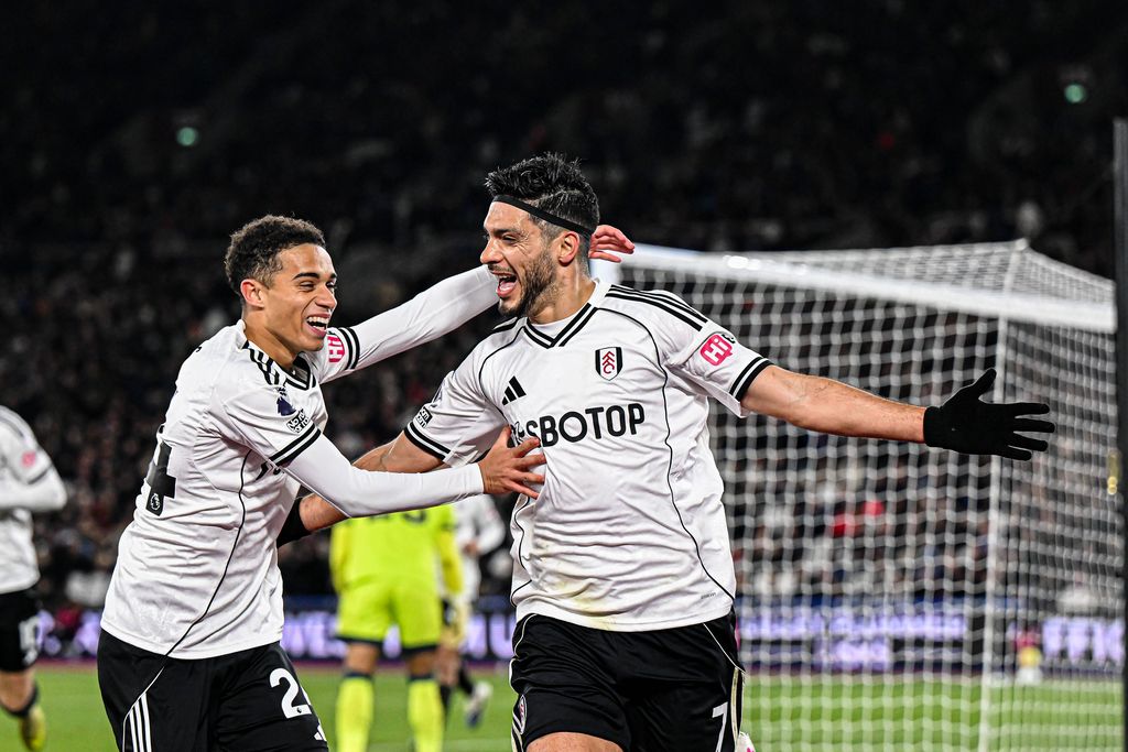 Raul Jimenez celebrates after scoring the team's first goal with Josh King during the Premier League match between West Ham United and Fulham