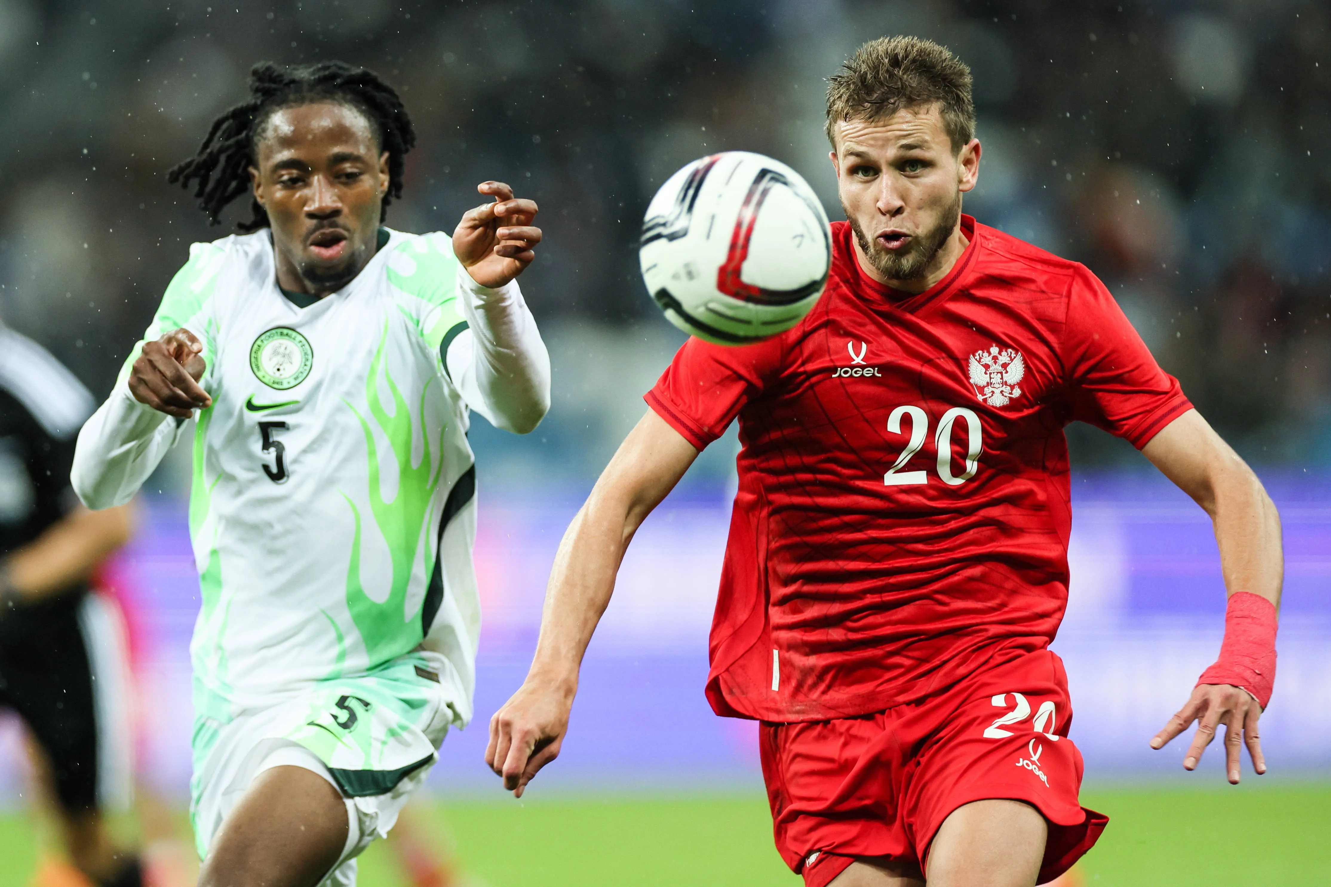 Super Eagles star Benjamin Fredrick and Russia's Lechi Sadulayev. 