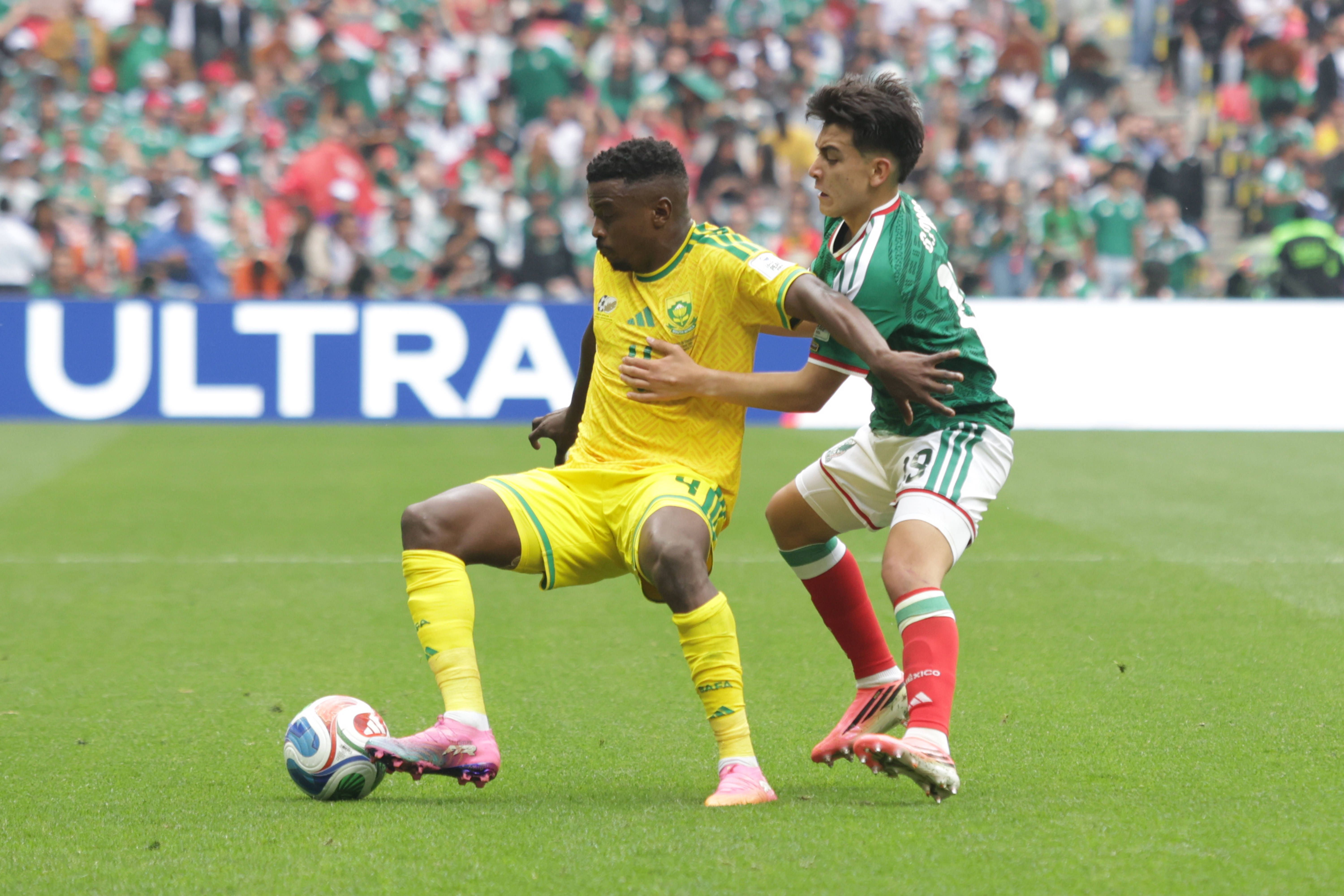 Teboho Mokoena 4 of South Africa national football team is pressured by Gilberto Mora 19 of Mexican national football team during the Group A first-round match at the 2026 FIFA World Cup, at Estadio Azteca on June 11, 2026, in Mexico City, Mexico.