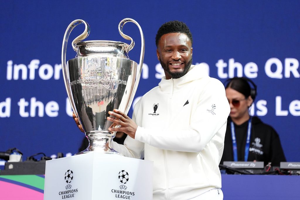 UEFA ambassador Mikel John Obi with the UEFA Champions League trophy during an opening ceremony at Trafalgar Square