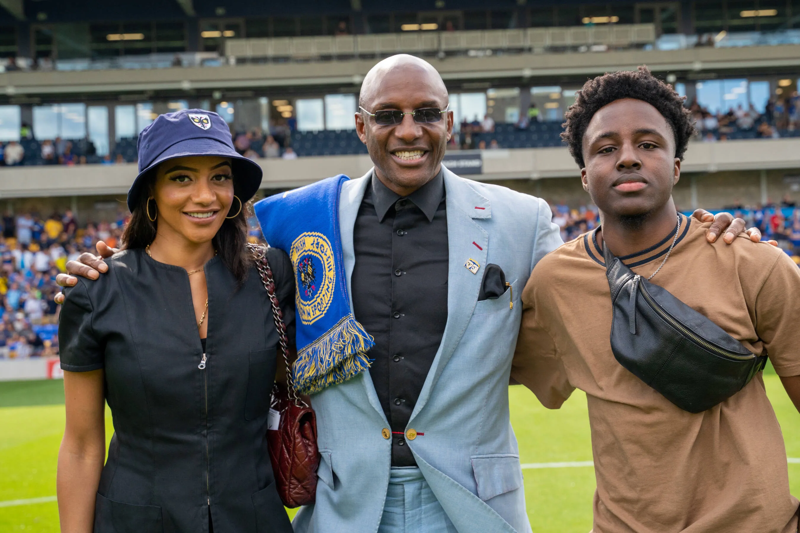 Wimbledon legend John Fashanu greets the AFC Wimbledon fans ahead of the EFL Sky Bet League 2 match between AFC Wimbledon and Barrow at Plough Lane, London, United Kingdom on 27 August 2022.