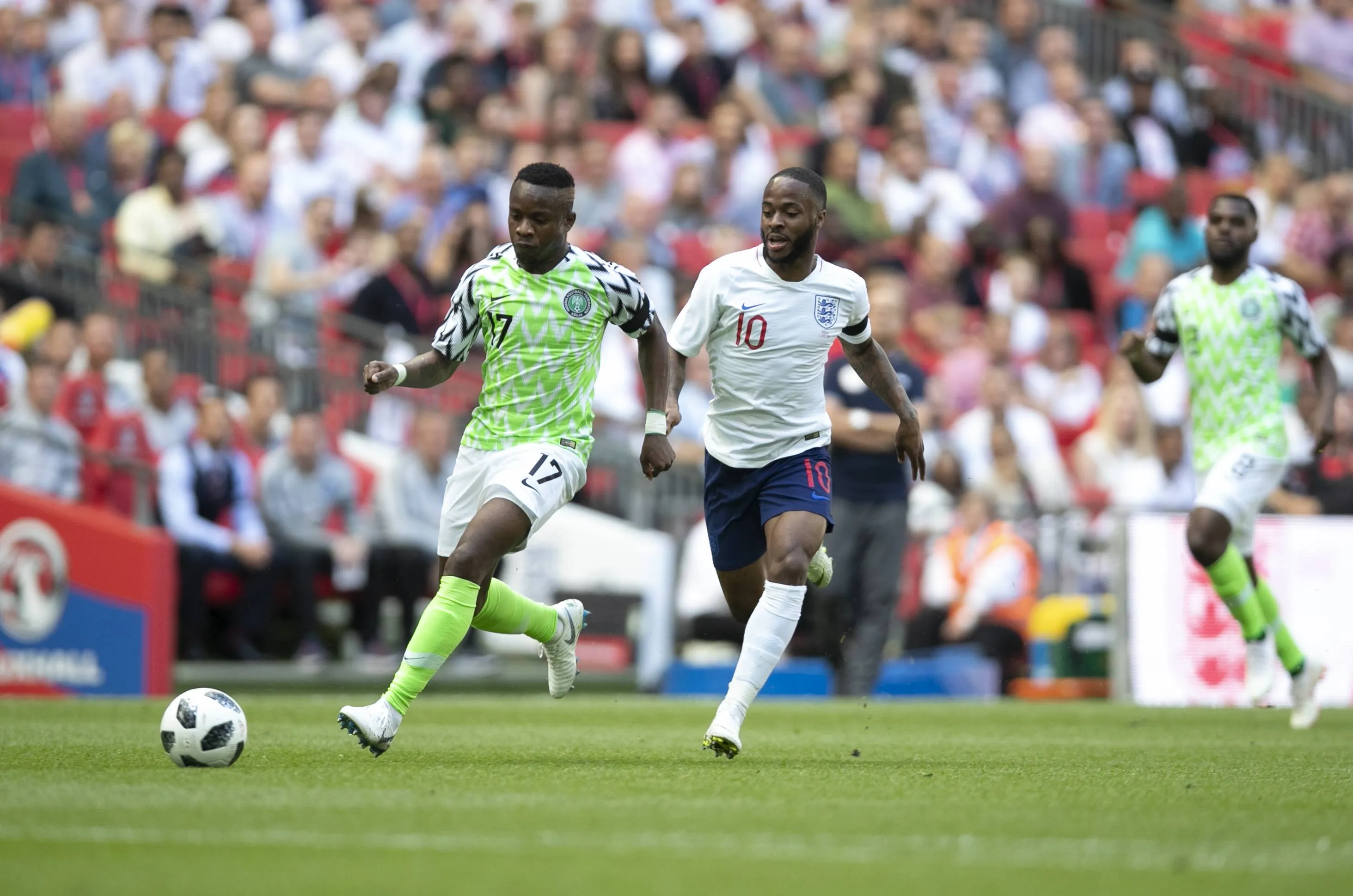 Raheem Sterling of England vies with Ogenyi Onazi of Nigeria