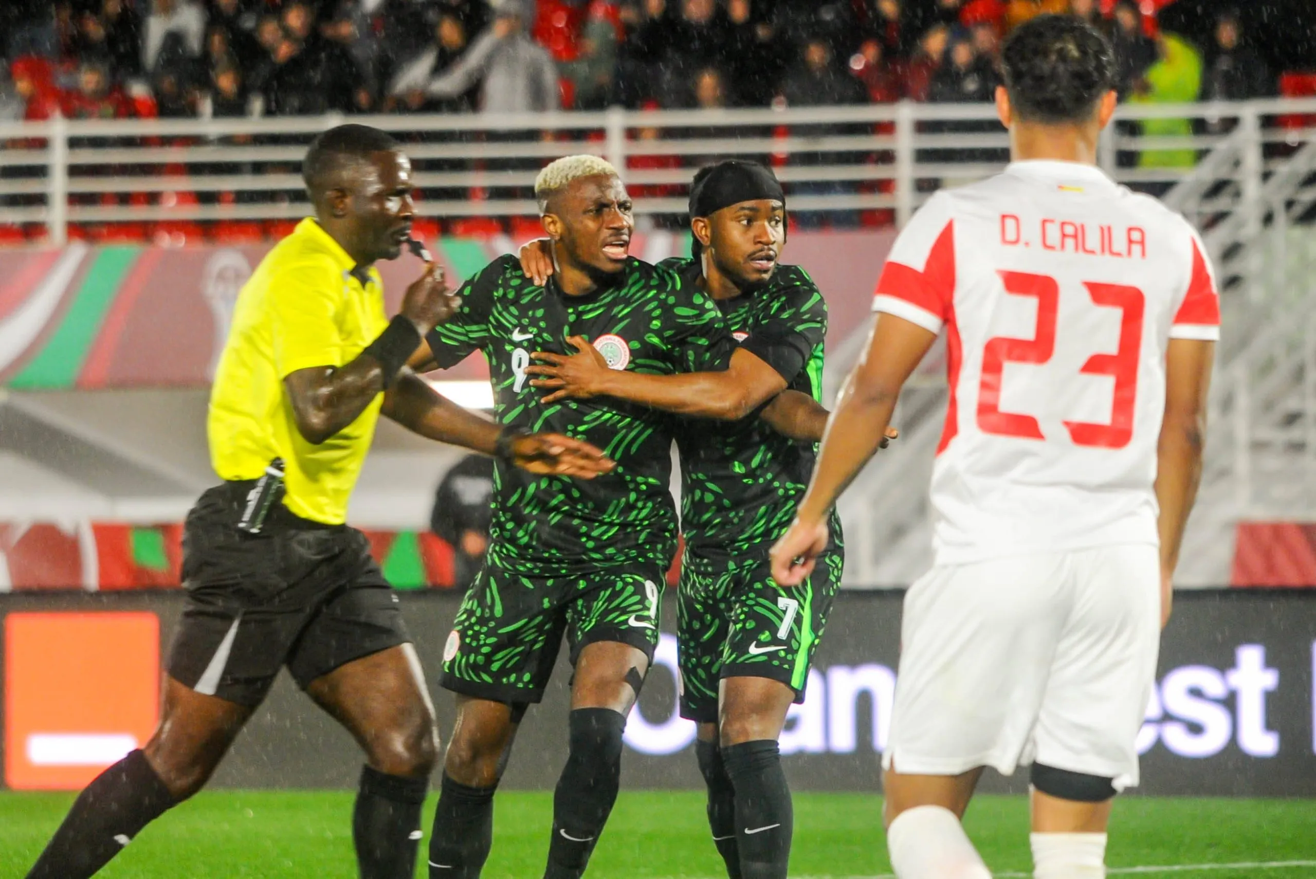 Victor Osimhen and Ademola Lookman of Super Eagles and Diogo Dos Santos Cabral of Mozambique during the 2025 AFCON
