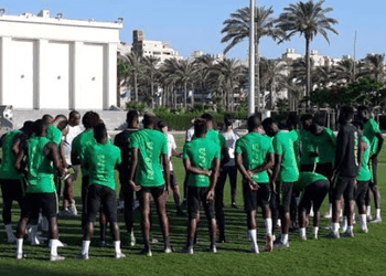 Super Eagles hopeful presents jersey to Buhari in Portugal