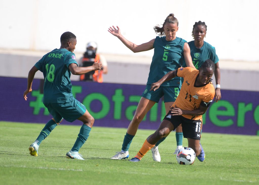 Barbara Banda and Ashleigh Plumptre during the 2025 WAFCON quarter Finals match between Nigeria and Zambia at Stade Larbi Zaouli