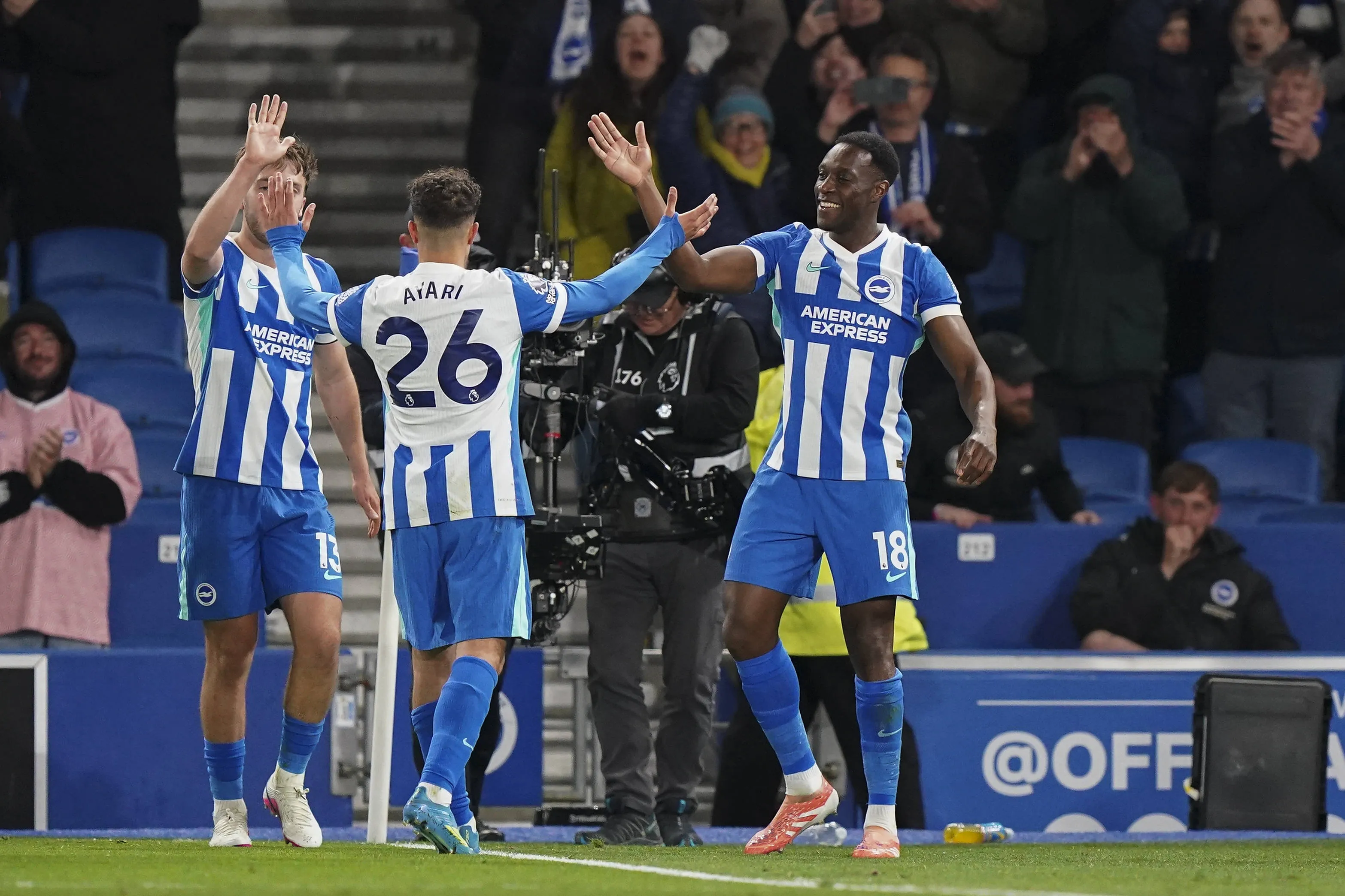 Brighton players celebrate after scoring against Chelsea