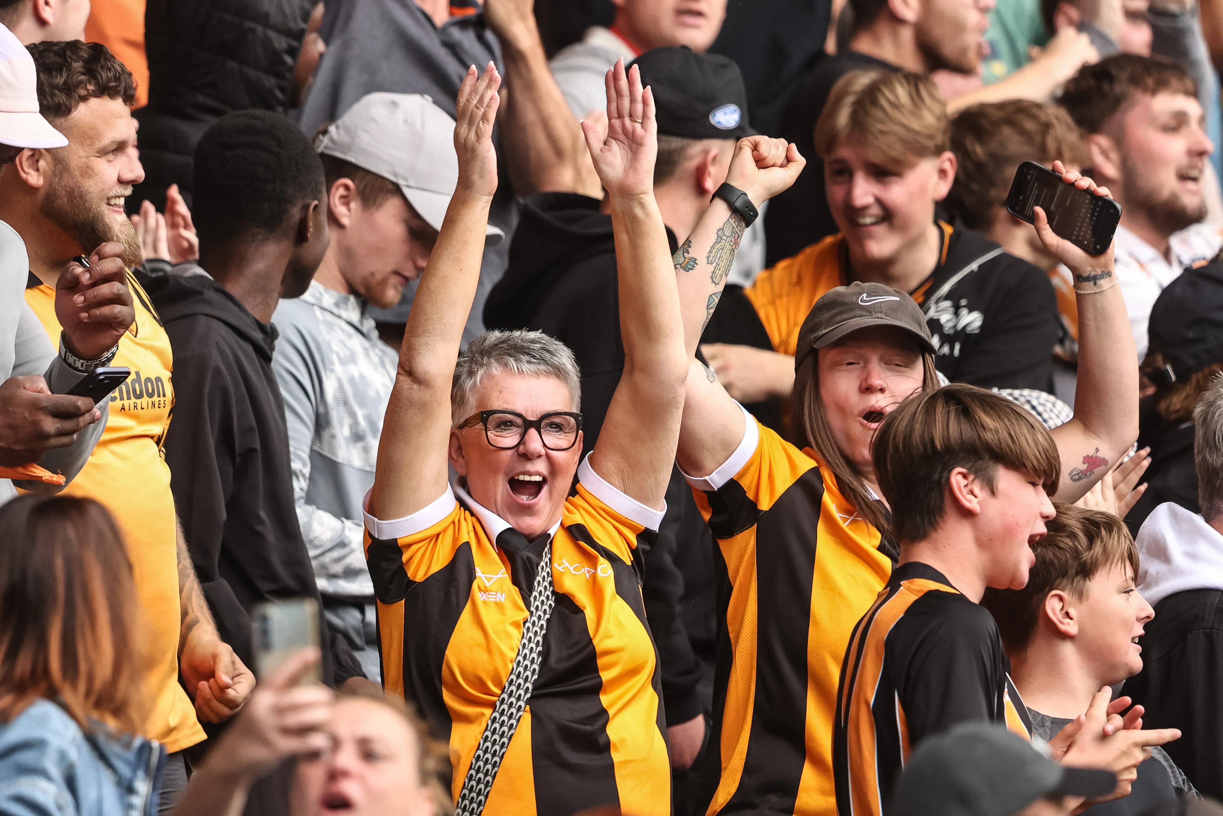 Hull City fans celebrate the opening goal of Semi Ajayi