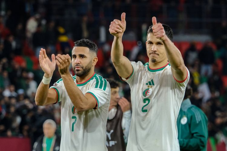 Riyad Mahrez and Aissa Mandi of Algeria