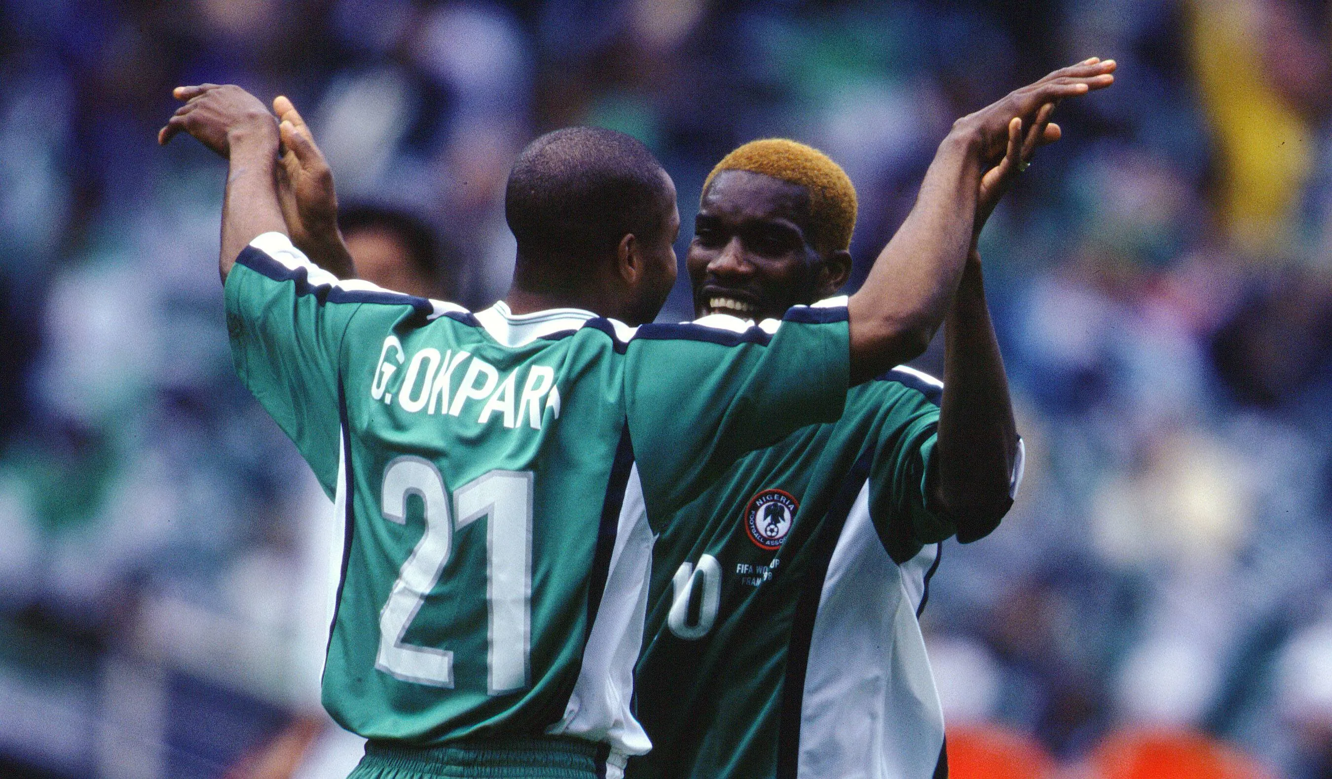 Augustine Okocha and Godwin Okpara in action for the Super Eagles of Nigeria