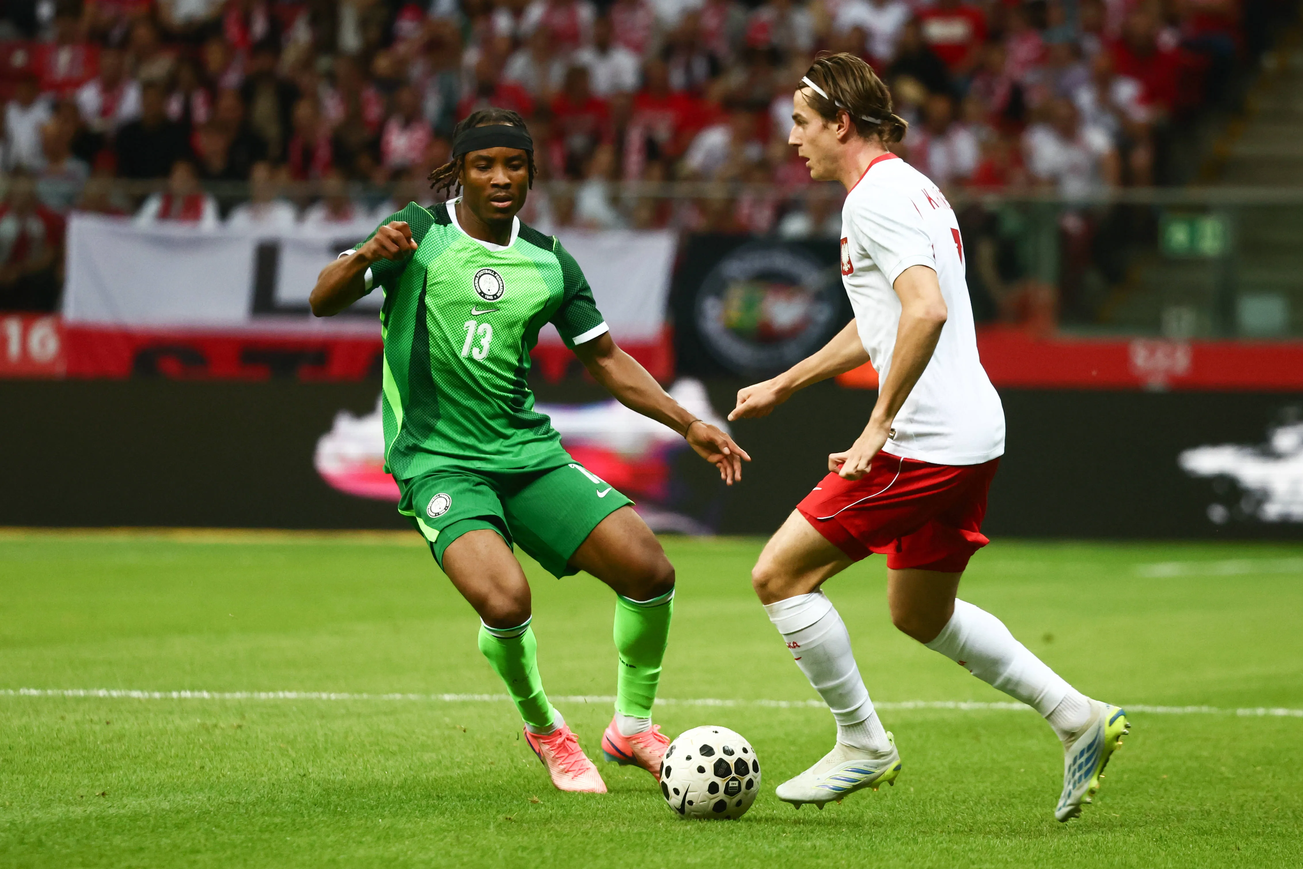 Bruno Onyemaechi and Jakub Kaminski during the Poland vs Nigeria match