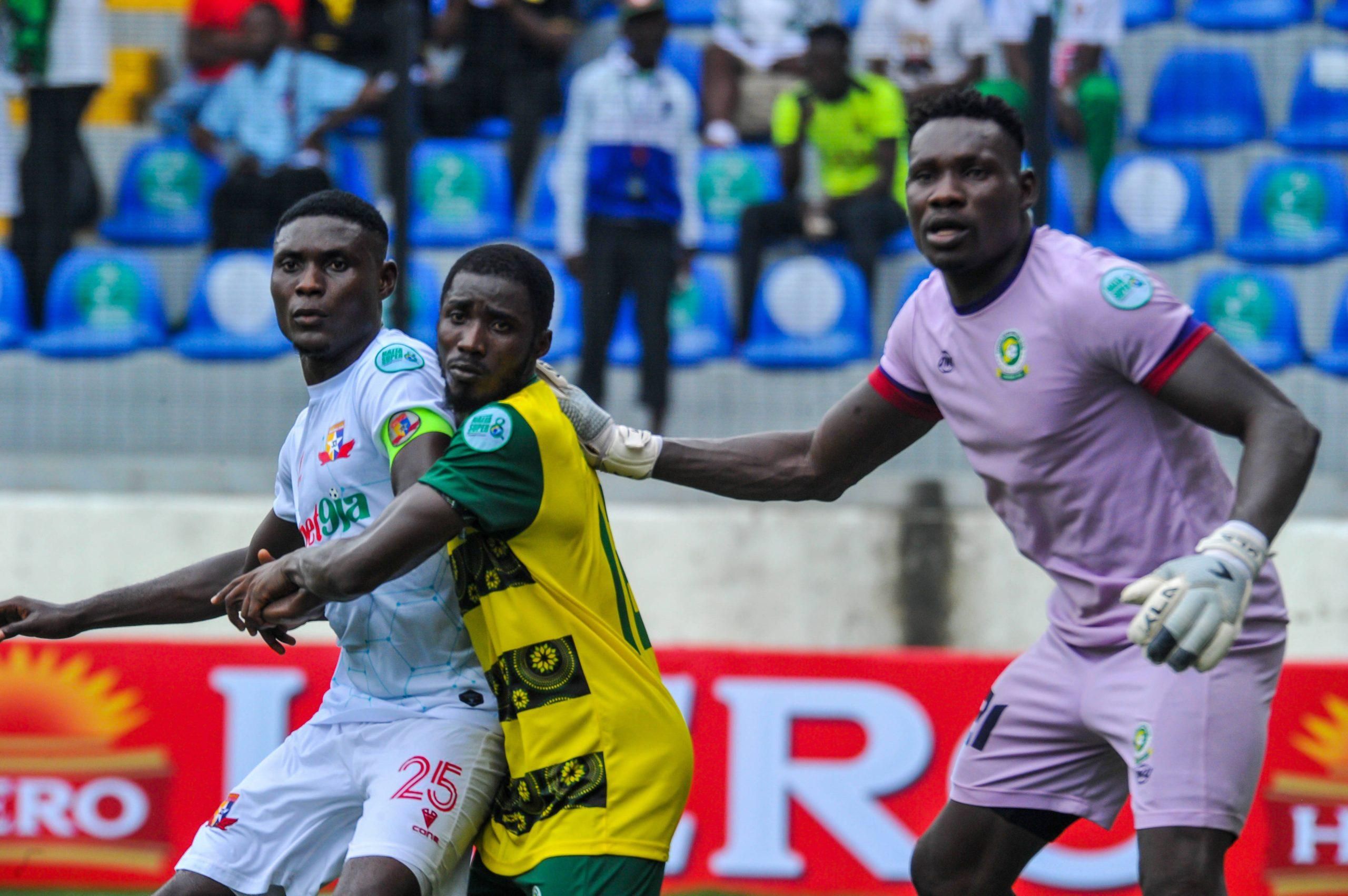Nduka Junior C of Remo 25 and KOKUMBO ALLADOUN Keeper of Katsina during the Naija Super 8 match between Remo Stars and Katsina United at Mobolaji Bank Anthony Stadium