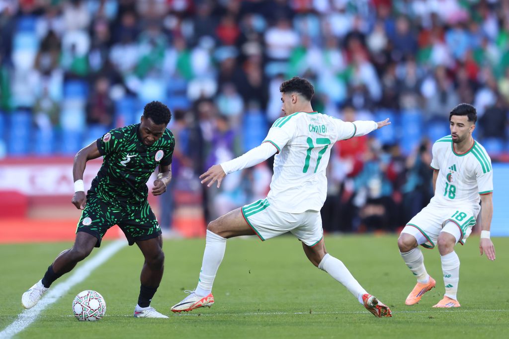 Bright Osayi-Samuel and Fares ChaÃbi during the Africa Cup Of Nations Quarter-final match between Algeria and Nigeria