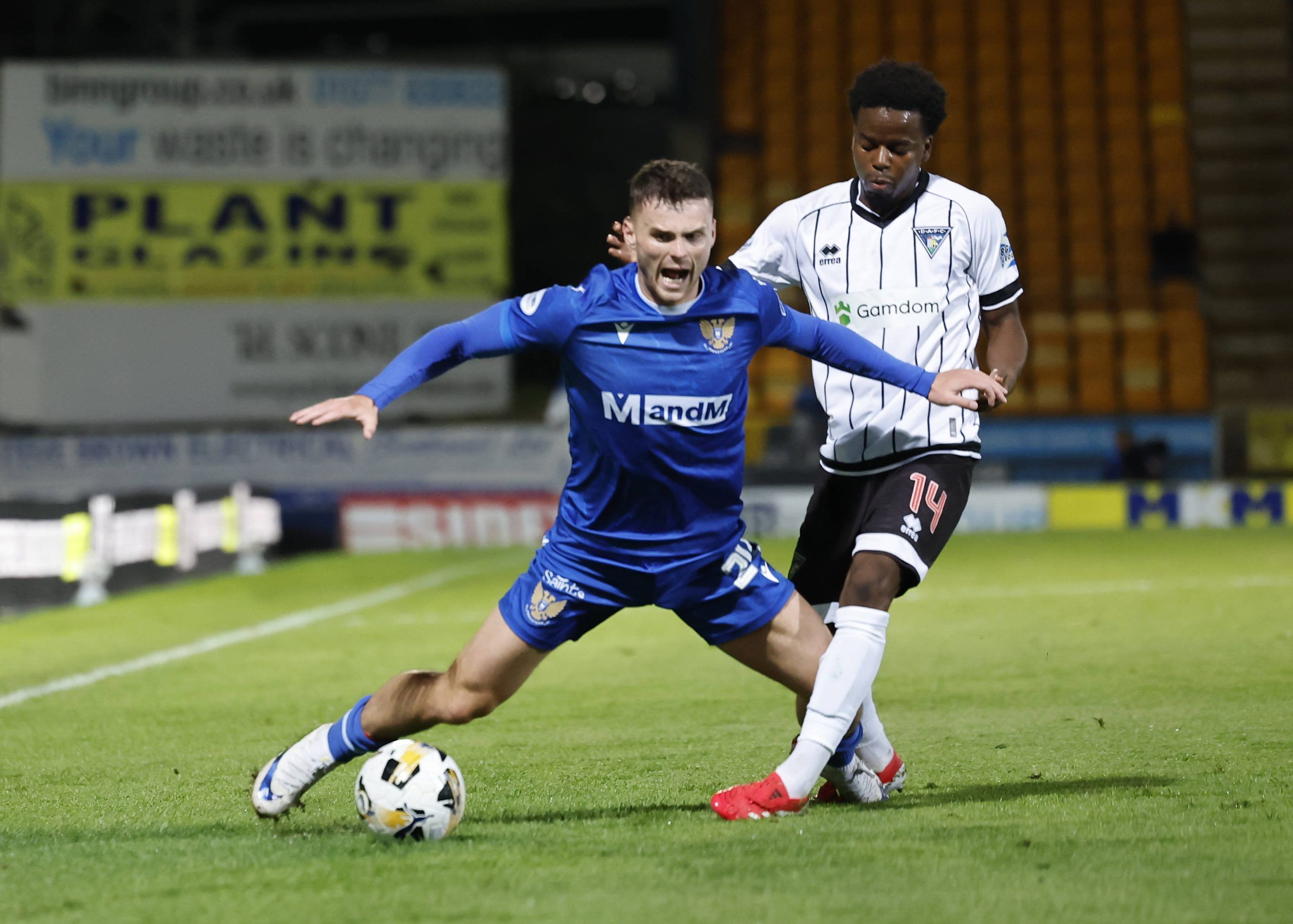 Josh McPake of St Johnstone left is tackled by Alfons Amade of Dunfermline Athletic during the William Hill Championship match at McDiarmid Park